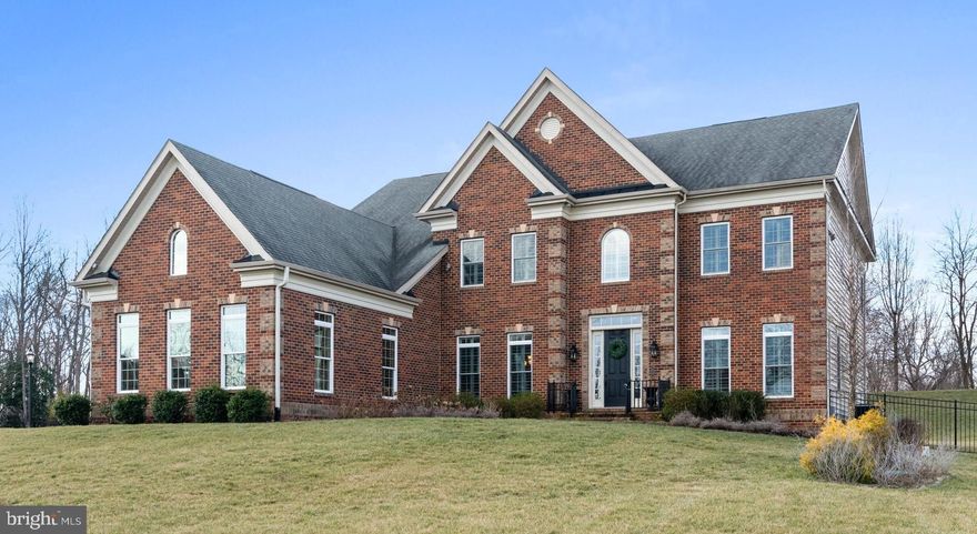 Welcome home to 1403 Falls Run Court in the exclusive Summit at Copper Ridge community. This stunning estate home boasts 6 Bedrooms, all with their own full bathroom, with 9 total bathrooms (7 full and 2 half baths). Four of the six bedrooms have walk-in closets! With over 8000 square feet of finished living space, you will have plenty of room to entertain friends and family! Enormous chef's kitchen with two huge granite islands great for entertaining,  ample cabinetry for storage, plus an eat-in area surrounded by windows with lots of natural light.  Home also features "his and hers' offices for those work-at-home days. The extra-large primary bedroom has a custom closet with built-in shelving, shoe racks, and laundry drawers, as well as a spacious balcony with french doors overlooking the woods, and a comfortable indoor sitting area with beautiful natural light. Many upgrades including a newly remodeled spa-like primary bathroom (2021) with a walk-in shower and shutters throughout the entire home! Finished walk-out basement (two exterior exit doors) with a home gym and stunning top-of-the-line custom home movie theater that seats six with projector, professional movie screen, and massive reclining leather movie chairs! The movie theater even has a custom glass front candy counter just like the real movies! The basement is extra-large and able to accommodate another bedroom for a perfect au pair or in-law living situation.  The basement has tons of unfinished space for storage, or for a new remodel of your own! Two laundry rooms, one on the main floor and one upstairs, plus a laundry room hook-up in the basement. Outside features a stone patio with a large stone fireplace, a fenced backyard, a whole-house generator, and an in-ground sprinkler system. A large one-acre yard that backs to a gorgeous wooded area for lots of privacy. House is nestled in a cul-de-sac great for kids! Award-winning Crofton schools, including brand new Crofton High School! And don't forget about the FIVE spacious garages all of which have professionally sealed floors! Convenient location for Baltimore/Annapolis/Washington, D.C. commutes. The home has been meticulously maintained by owners and truly shows like a model home!