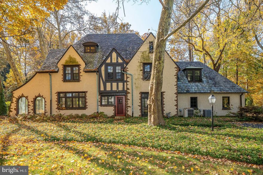 A captivating property. This enchanting 5 bedroom/3.5 bath home was built in 1920 with unique architectural details that add character and charm to the house. It sits on a gorgeous 1.42-acre level lot surrounded by mature landscaping, a very significant asset, situated on one of the most sought-after and bucolic locations in Radnor Township. 
The opportunity of endless expansion and the potential of building a new dream home on its grounds opens up exciting possibilities for buyers who want to customize the space to their preferences. 
The first floor of the house includes a large and elegant fireside Living Room, a formal Dining Room with custom built-ins and a bank of windows to enjoy the surrounding mature landscaping, a Kitchen open to a Breakfast Room with a sitting area (both w/radiant heat), an inviting/Sun Room/Family Room with brick floor, three walls of windows for fabulous scenic views and an exit to an exquisite stone patio, and a pretty Powder Room. The second floor offers a spacious Primary Bedroom with large windows overlooking the picturesque backyard and en-suite Bath; a cozy Library/ Office with floor-to-ceiling bookshelves that could also serve as 5th bedroom, 2 other Bedrooms (one connected to a wonderful bonus room that adds versatility to the space and has been used as a sitting room/playroom, and a great hall Bath w/radiant heat. The laundry is on this floor, adjoined to the primary bedroom. The third floor presents a cozy 4th Bedroom, a full Bath, ample Attic storage, and a substantial walk-in cedar closet. The Basement is full and unfinished. The aesthetically pleasing circular driveway allows for easy access and egress from the property and the two-car garage.
A home like this one in such a superb setting and location is a rare find. It is not only close to parks and trails but schools, and shopping, and offers an easy commute to Center City, the airport, and major highways. 
This elegant five-bedroom house may need some cosmetic touches inside (paint, carpeting...) and some exterior work but it is a precious very livable home located in an oasis of beauty and tranquility. All second-floor windows, the third-floor double-hung windows in the finished space, and the outside kitchen door were replaced in 2008; the kitchen and all baths were redone between 2002 and 2009).
In summary, this property is a rare versatile find, combining a unique home with a fabulous lot in an attractive location with the potential for customization and expansion.