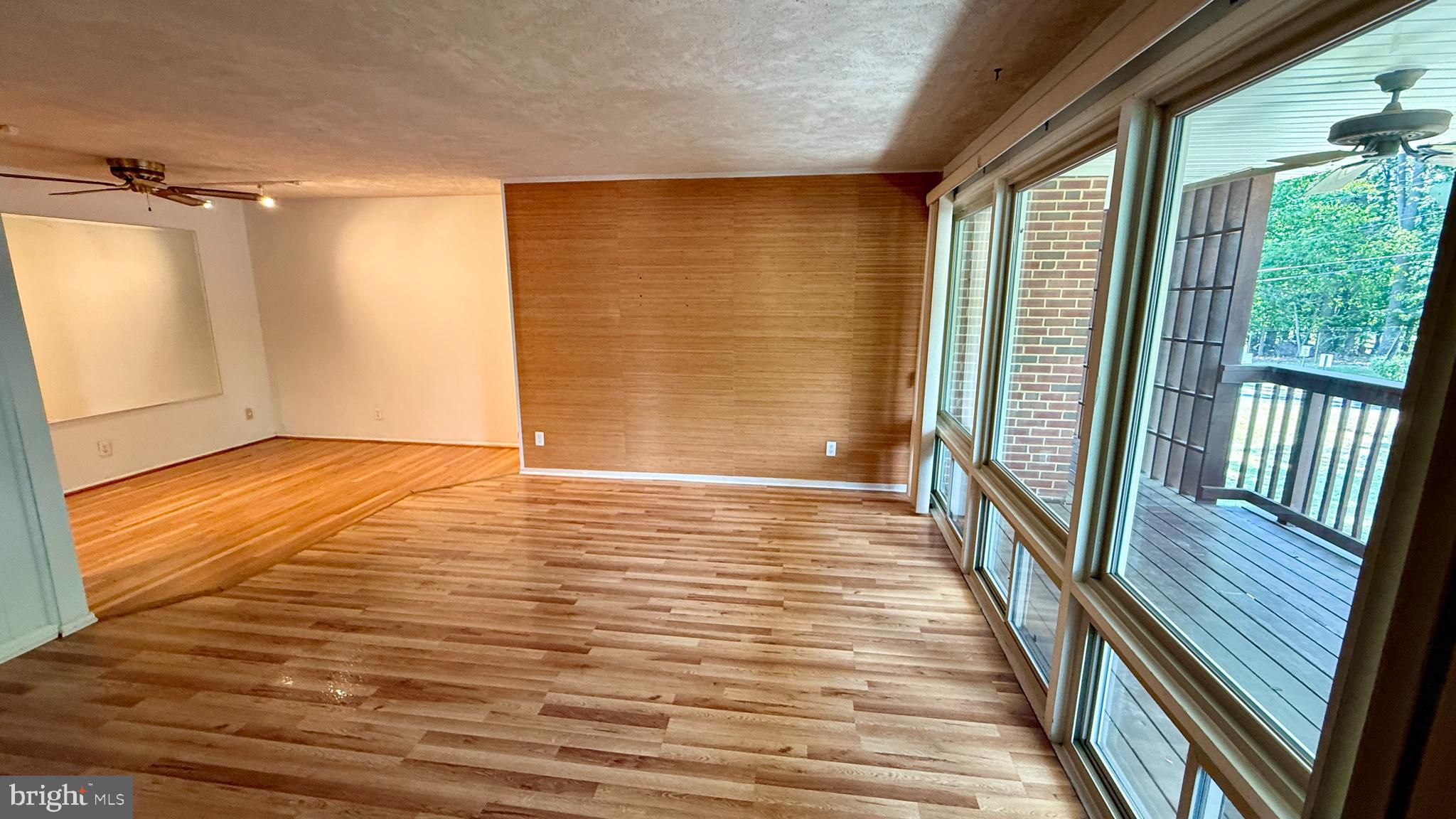 Fantastic, walkable condo in park-like setting in Rockville! This beautiful, top floor, two bedroom garden-style condo is ready for its new owners to move right in! Fresh paint and hardwood throughout, custom master closet, and floor to ceiling windows filling this home with light. The expansive balcony is complete with ceiling fans for al-fresco dining or just listening to the birds in the many surrounding trees. Unit includes new bath tub and kitchen sink, and two parking spots in lot. Close to metro, shopping, restaurants, and downtown Rockville.