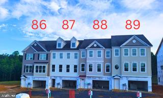 Unit 87 Madison D3:
Welcome to Meadows at Town Run.... Leonardtown’s Newest Townhome Community by Quality Built Homes! Discover the Madison-D3 Interior Unit, a thoughtfully designed 3-level townhome offering 2,604 sq ft of beautifully finished living space. This interior unit features an oversized one-car garage and an entry-level flex space that includes built-in cubbies and coat hooks, plus a versatile room that can function as a fourth bedroom, guest suite, or recreation room, complete with a full bath and closet.
The main level boasts a spacious and open kitchen with Quartz countertops, brushed nickel fixtures, a center island, large walk-in pantry, and breakfast nook. The open-concept family room flows seamlessly from the kitchen to a 14x12 maintenance-free deck overlooking a fenced backyard—perfect for outdoor entertaining.
Upstairs, retreat to the owner’s suite with tray ceiling, walk-in closet, and a luxurious Deluxe Signature Shower by QBHI featuring floor-to-ceiling tile, dual showerheads, a built-in seat, ledge, shelving niche, and recessed lighting. Two additional bedrooms, a full hall bath, and a convenient laundry room complete the upper level.
Community amenities include sidewalks, a swimming pool, recreation center, pickleball and tennis courts, and playgrounds—all located in the heart of charming Leonardtown, Maryland.
Receive $7500 in closing help with preferred lender and title company. Ready for September delivery. Come experience the unmatched quality and thoughtful design that sets Quality Built Homes apart. Schedule your tour today!