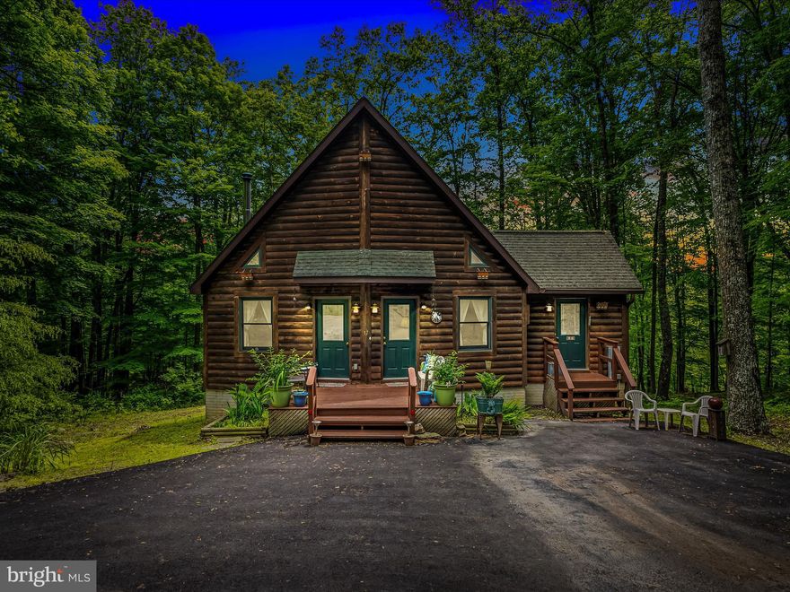 Remarkable chalet in the Coolfont Mountainside.  3 bedrooms and 2 full baths on three levels.  Many great features to include pine accent walls, lots of natural light, and plenty of space.  Office space, a wood stove, and a paved driveway are other nice features. Features a full walkout basement with laundry.  Neighborhood is 10 minutes from Berkeley Springs and about the same to Cacapon State Park.  Community features a pool, hot tub, hiking trails, a playground, tennis courts, and much more. A must see!