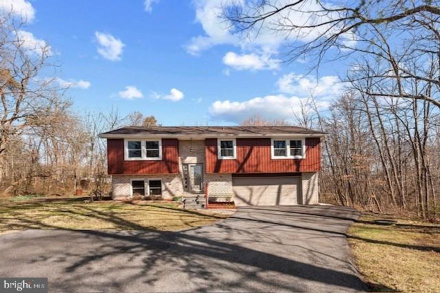 SIGNIFICANT PRICE REDUCTION.....OWNER SAYS "SELL" !  Don't miss out on living your best life in this sought-after lakeside community in historic Gettysburg, PA.  NEARLY EVERYTHING IS FRESH AND NEW!  Come enjoy life at the lake in this recently renovated four-bedroom home in the desirable Lake Heritage Community.  Located just a short 2 min walk to the lake, this home provides a peaceful setting while being conveniently close to the area's many attractions.  Lake Heritage is an easy drive to Washington DC, Baltimore Md., and Harrisburg Pa.  Set on a secluded cul-de-sac within walking distance of the community boat launch, this elegant split foyer home offers a private wooded setting on over half an acre.  The home now offers 4 generous-sized bedrooms with 2 full, and 1 half bathrooms.  The main level features a large, eat-in kitchen with granite countertops, and an abundance of cabinets with wine rack, a built-in microwave, disposal, and range hood, The combination living room/dining room leads to the newly renovated deck.  Further down the hall you'll find the main bathroom, master bedroom with full bath, and two additional bedrooms.  On the lower level is another bedroom, laundry, a large family room, half-bath, and access to the over-sized 2-car garage.  The list of recent updates includes new roof, gutters, and soffits, new driveway, and exterior siding (all in 2023), all new Pella windows, new flooring, trim, and fresh paint.  The hot water heater was just replaced in June of 2024 as well. Year-round comfort is provided by radiant heat, two mini-split systems, and a pellet stove in the lower-level family room.  Outdoors you'll find a fully landscaped yard with a large shed. This home provides everything your family needs to live and grow, while taking advantage of everything the Lake Heritage Community offers including a 154 acre lake, several boat launches, Olympic-size swimming pool, community room, 24 hour security with gated access, tennis, pickleball, basketball and shuffleboard courts, volleyball and horseshoes, several community recreation areas, pavilions, and playgrounds, dog park, access to a privately owned marina and many community-sponsored events & clubs including Women's Club, Fishing, Children's Garden, crafts, etc. 
Call LA with any questions and to arrange your private showing today!