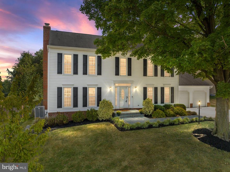 Welcome to this charming colonial situated on an oversized .31 acre lot brimming with privacy and mature trees. Upon entering, you will find gleaming hardwood floors and an open floor plan ideal for today’s modern living. The highlight of this home is the updated kitchen featuring gourmet appliances including a convection range and professional grade hood. Custom kitchen cabinetry with under mount lighting provides abundant storage. Plus stunning glass tile backsplash, quartz countertops and center island for casual dining and entertaining. The kitchen flows into the cozy family room with wood burning fireplace. The adjoining screened porch, Trex deck and large patio create a comfortable flow for outdoor gatherings. The main level boasts a convenient flex space currently used as a home office, formal dining room, powder room and laundry room. Recently installed low profile LED lighting throughout the home adds a modern, energy efficient convenience. Upstairs you will find the primary suite with hardwood floors, dressing area and FIVE closets! The attached primary bathroom has been updated with dual vanities. Three large and sunny bedrooms with newer carpeting, plus an updated hall bathroom complete the second floor. The lower level is finished with a workout space and full bathroom. If you like to entertain, this home has it all! The spacious recreation room has been outfitted with a wet bar with beverage refrigerator, projector, screen and speakers ready for football season or movie night. Freshly painted throughout and a new Tesla charging station in the garage. HVAC replaced in 2019. New siding 2019. This home is move-in ready! Popular Potomac Falls HS pyramid! Excellent commuter location within minutes of Routes 7 and 28. Close to Dulles Town Center, dining, shopping and more!