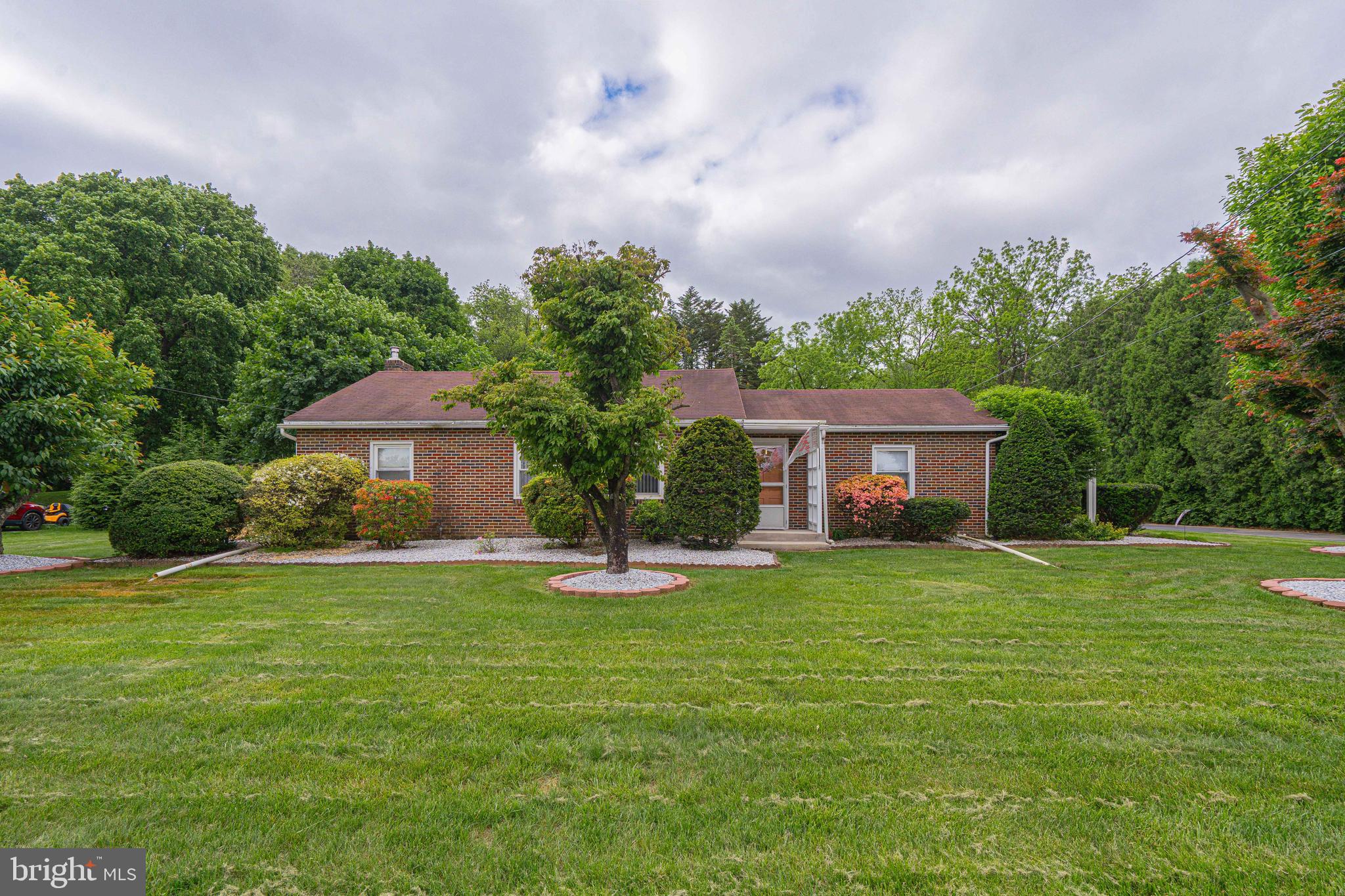 Cozy All-Brick Ranch. Welcome Home! Comfortable first floor living that perfectly blends Warmth and Functionality. Opening the front door you enjoy the bright spacious living room with bay window. There is an open-concept kitchen with Large pantry and dining area, perfect for cooking, entertaining, & everyday family meals. All appliances remain for the new owner. Off the kitchen you will find the convenience of a half bath & one of the bedrooms that is used as an office. There are two other bedrooms & full bathroom that complete the main level. Full basement offering endless possibilities & ready for your finishing touches. Create a rec room, gym or extra storage! There is a 2 Car Heated Detached garage and additional parking space. The backyard has a covered patio off the kitchen and an extended open patio great for grilling, relaxing, or hosting summer get-togethers while offering privacy backing up to woods. Invisible pet fence installed for peace of mind for you & freedom for your pets. Central Air for those hot days, tilt-in windows & Many Recent updates ensure comfort & efficiency, including a brand-new Furnace (May 2025), Water Purifier, UV Light (April 2025) Plus Many more updates. The location is close to commuting routes, shopping, restaurants and half way between Allentown and Reading. Don't miss your chance to make it your own! Furnishings and lawn equipment are negotiable