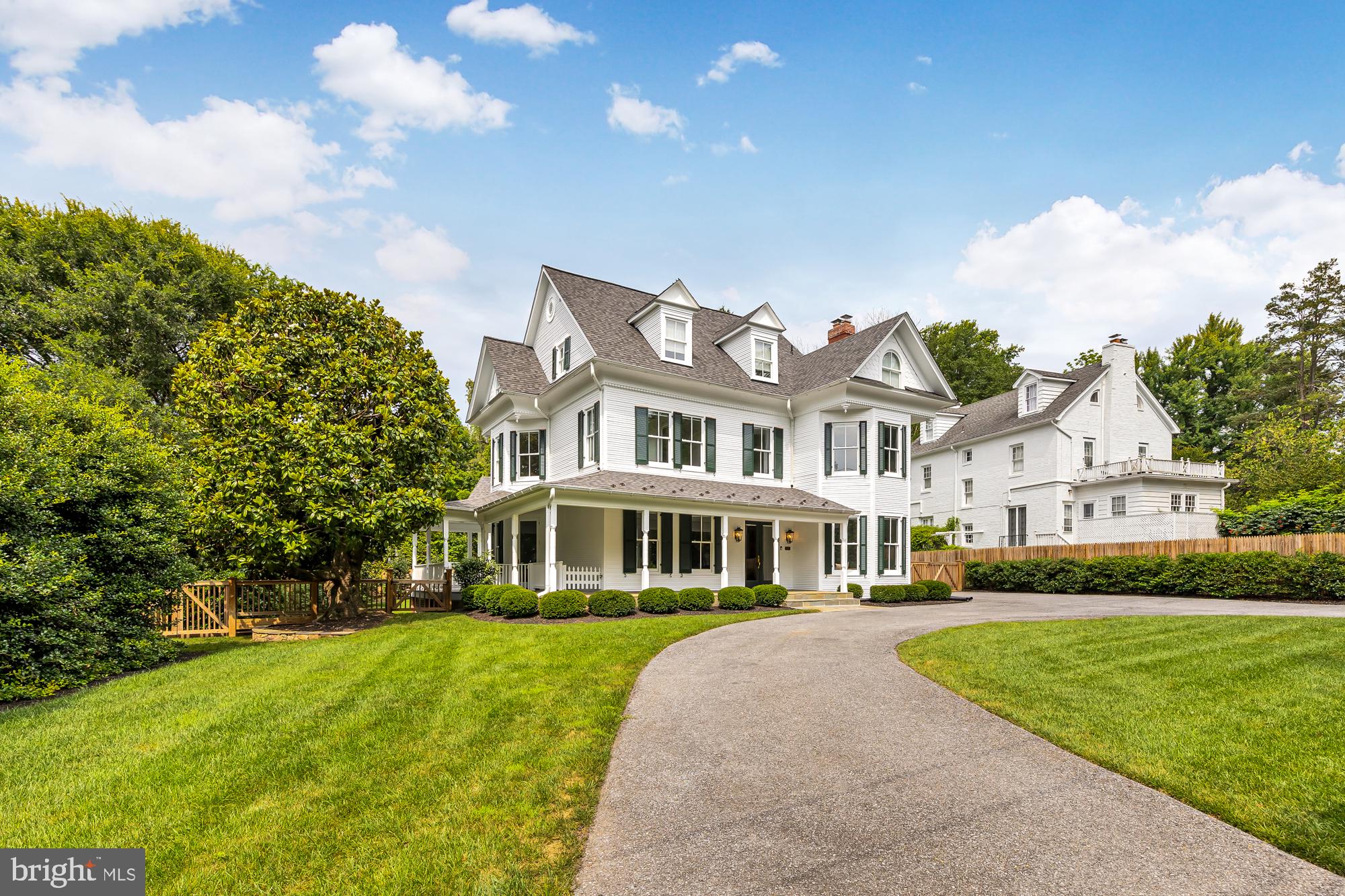 Welcome to 6208 Wisconsin Ave, a spectacular Victorian-style home located in the desirable Chevy Chase neighborhood, between the shopping districts of the Friendship Heights metro and the Bethesda Metro.
This magnificent residence boasts 6 bedrooms, 5 bathrooms, and spans across 4 stories. As you approach the property, you'll immediately notice the charm and elegance it exudes. The home is set far back from the street, providing a sense of privacy and tranquility. The large porch invites you to sit back and relax while enjoying the surrounding beauty. The property offers convenient parking options with a generous detached 2-car garage and a huge circular driveway capable of accommodating 9+ cars as well as easy access to the main road.
Step inside, and you'll be greeted by a beautifully renovated and restored interior that seamlessly blends exceptional old-world charm with modern-day amenities. The residence showcases 11-foot ceilings, stunning original wood floors, and beautiful fireplaces, creating an atmosphere of grandeur. The main level features a well-equipped, modern kitchen with stainless steel appliances and a breakfast bar. A spacious family room, complete with a cozy fireplace and large windows, provides a warm and bright space to gather with loved ones. To the left when you first walk into the house, there is a den offering a private retreat for relaxation or work. The main level also includes a separate formal dining room, perfect for hosting elegant dinners and special occasions. Additionally, a separate formal living room offers another area for relaxation and entertainment. The bedroom on the main floor could also serve as a private office or study.
The primary suite is a true oasis, boasting stunning views of the golf course across the street to start your day with sunshine and serenity. It features a lovely ensuite bathroom with a tub and standing shower, as well as a large walk-in closet. There are 2 additional bedrooms and a hall bathroom on this level, in addition to the loft, overlooking the kitchen and family room—perfect for a homework station, home office, playroom, gym, etc. The top floor offers 2 additional bedrooms and another full bathroom, and an enormous recreation room with lofted ceilings.
The home also includes a fully finished basement that offers a sizable recreation room (can also serve as a bedroom as it exits to the outside and has large closets) and a large bathroom. And for those seeking relaxation and wellness, an in-house sauna awaits. Just outside the basement you’ll find a unique feature: a 1942 grotto providing a covered and cool spot with beautiful landscaping and flowers to relax and enjoy the outdoors. A large backyard offers endless possibilities for outdoor enjoyment and entertaining. Located in Chevy Chase directly across the street from the golf course at the Chevy Chase Club, and with close proximity to DC, Bethesda, and the Beltway, you'll have convenient access to a multitude of amenities, including shopping, dining, entertainment, and outdoor recreation.
This residence was originally built in 1908. The current owners purchased the home in 2014 and have significantly upgraded the home. Some of the most notable improvements include a complete roof replacement in 2020 with 50-year architectural shingles, replacement of all three HVAC systems with Trane units and regular bi-annual servicing, extensive landscaping, Marvin double-pane insulated windows received recent maintenance, the exterior was repainted and partial siding replaced, along with new shutters and copper caps. A sprinkler system with 12 zones was installed, a new sump pump with battery backup was installed, the water heater undergoes annual draining and servicing, and the driveway has also been repaved. See full list of upgrades in the documents section.
With its timeless beauty, modern upgrades, and meticulous maintenance, this exquisite Victorian-style home offers an unparalleled living experience.