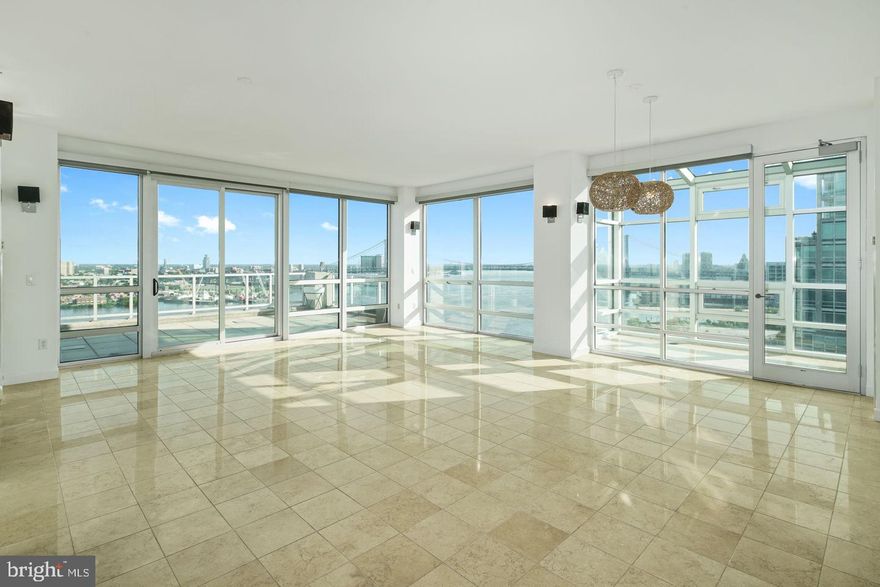 Experience refined riverfront living in this spacious three - bedroom, three and a half Mini Penthouse overlooking the serene Delaware River. This beautifully designed home features a bright southeast exposure, with 10 ft ceilings, walls of windows, an open- concept living space to enjoy unobstructed views of the Ben Franklin Bridge and gorgeous morning sunrises. The modern kitchen flows seamlessly into the living and dining area- perfect for entertaining or relaxing with scenic water views. Each generously sized bedroom offers great closet space with the master bedroom offering its on en-suite bath for ultimate privacy. Additional highlights include a spacious 500 sq ft balcony, two-parking licenses, climate-controlled storage locker, guest parking, 24 hr. manned guard gate for ultimate security, concierge services, state of the art fitness center, spa-services, river deck, lap pool, shuttle service to Center City, just to name a few. Don't miss the rare opportunity for luxury, convenience and spectacular views- All in one!