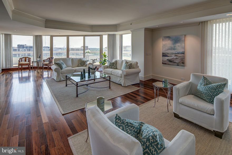 FABULOUS NEW PRICE! Welcome to this captivating complete renovation of Penthouse 18B in Somerset House One (electrical/plumbing/floors/walls, lighting, mouldings and cabinetry).  All major rooms open onto the wrap-around terrace. Offering extraordinary light and space, this 3,550 square foot, three bedroom, two full, three half bathroom residence is enhanced by the finest materials and finishes. The entry gallery with coat closet and charming powder room leads to the breathtaking great room wrapped by a private terrace of nearly 900 square feet. Custom millwork and lighting along with a gas fireplace and wet bar provide magnificent amenities for entertaining along with a sumptuous dining room.  The gourmet kitchen with breakfast room designed by Jenifer Gilmore is enhanced by a sunny exposure and features granite countertops, an island, double ovens and storage galore.   A cherry panelled library just off the formal living room leads to the bedroom wing of the residence. The stunning master suite opens to a sitting room with spacious walk-in closet, vanity and a large luxurious bathroom. Located in the heart of Chevy Chase, Somerset House is just moments from vibrant restaurants and boutiques by prestigious designers and luxury brands. A private paradise for residents, the legendary Somerset House amenities include 24 hour gatehouse, doorman, front desk, indoor and outdoor pools, sauna, gym, racquet ball and tennis courts. Included in this offering are assigned parking spaces and three storage units.  Somerset House offers an unparalleled lifestyle with an array of services and security that is unmatched in luxury condominium living.