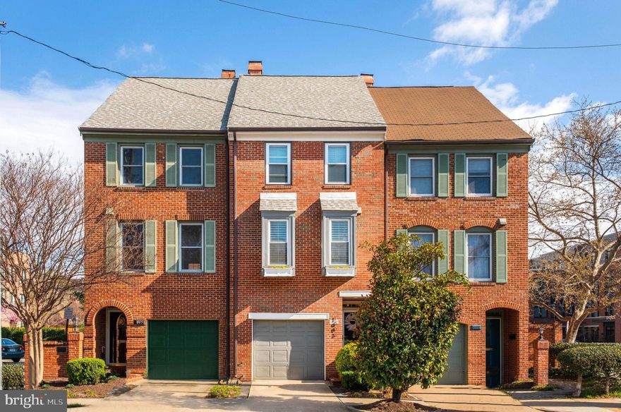 Light-filled and bursting with charm, this updated townhome with garage ticks all the right boxes. From the moment you step inside, you'll notice the warmth of hardwood floors, attractive custom built-ins, and thoughtful details throughout this well-kept property. 

The kitchen is tastefully updated with white cabinetry, quartz countertops, and GE appliances, and is all the more unique with window seating framed by plantation shutters. A double pantry adds bonus storage, and there’s even more tucked under the stairs. The living room offers a wood-burning fireplace, built-ins, and Juliet balconies with double French doors, while the dining area features a built-in buffet with unique herringbone pine accent wall and soft accent lighting. 

Upstairs, both bedrooms are graced with ensuite baths. The primary bedroom is sized for a king bed and offers plenty of closet space, while the updated bathroom features marble-tile and a quartz counter. The secondary bedroom suite is spacious and features a refreshed bathroom with extra wide vanity.

On the entry level, a cozy second living space with double French doors leads to a private patio with classic Old Town brick walls and string lights—ideal for outdoor entertaining. There’s also a powder room, additional built-ins, board and batten detailing, and a second wood burning fireplace, likely to make this your favorite room in the house. Parking is easy with an attached garage with extra storage, a driveway, private assigned spot, plus on street parking.

From the moment you enter, this property feels like home. Its charm is matched by an unbeatable location that is highly walkable to the best of Old Town, including a short walk to Braddock Road Metro, Trader Joe's, Oak Steakhouse, the Waterfront, and local events like Alexandria's Birthday Celebration with a fireworks display on the water, First Night New Years Celebration, King Street Arts Festival, and weekly trips to the Market Square Farmers Market. Nestled in the heart of one of the most vibrant small-town cities, 1003 Pendleton is the perfect place to put down roots.