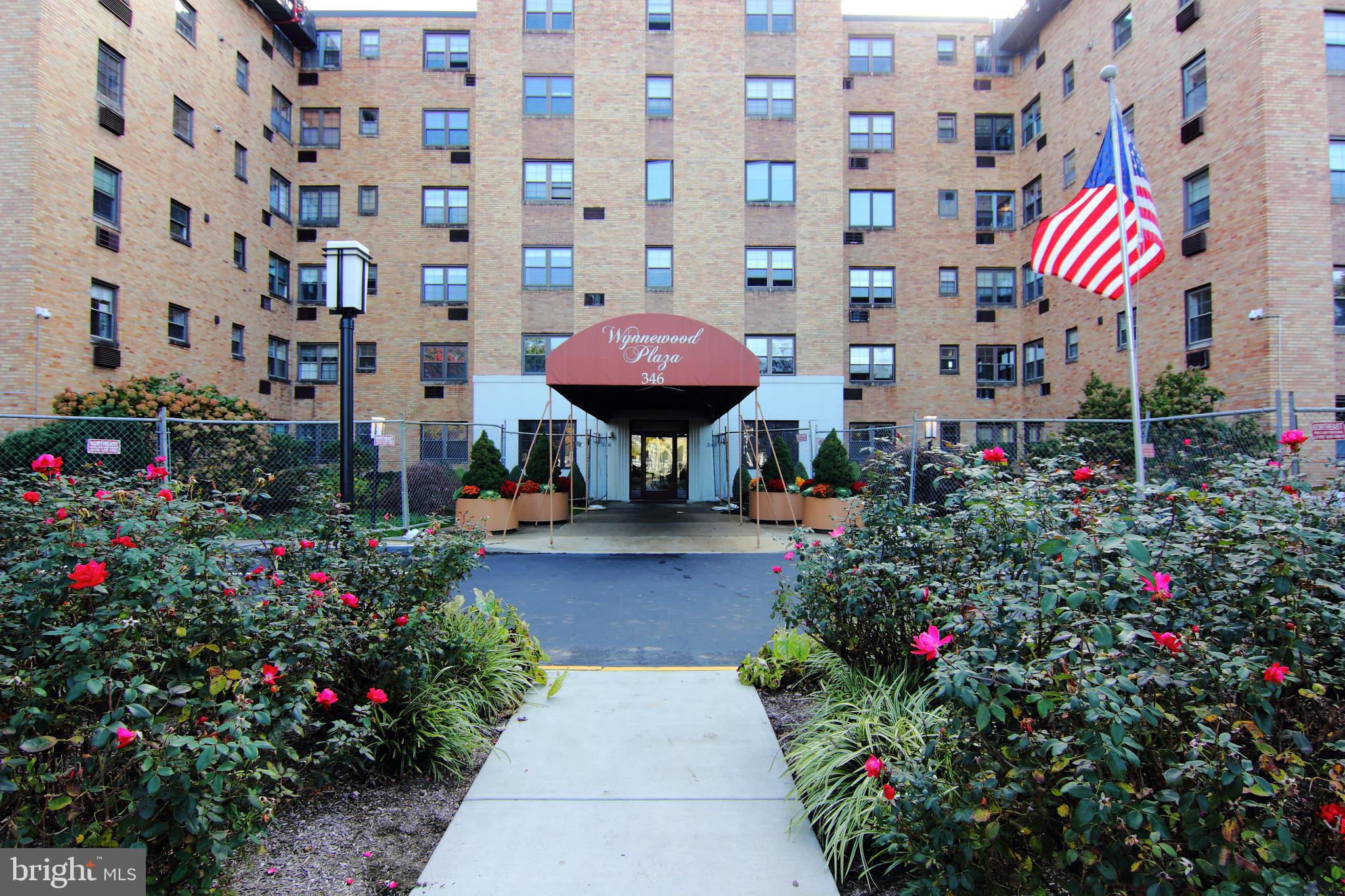 Welcome home to the 'Wynnewood Plaza' - Spacious one bedroom high-rise living with fabulous amenities right on the Main Line! Across the street you'll find Whole Foods, CVS, Bed Bath and Beyond, Giant, the train to Center City and many more shops and restaurants. This fifth floor apartment offers a very large bedroom with 3 closets, a newly renovated full bathroom, light-filled kitchen, den/bonus room, massive living room and dining room, in-unit washer and dryer, powereful A/C window units, and stunning hardwood parquet floors throughout. Enjoy the sunny rooftop deck (with literally the best views on the Mainline), gym, and the community room/library. Walk to shops, restaurants, grocery stores, public transportation via R5 train or Septa bus. Lower Merion School District. Free parking lot space or paid indoor parking. $35 Application fee. Immediate availability. Landlord will prorate first months rent. (Condo rules available upon request)