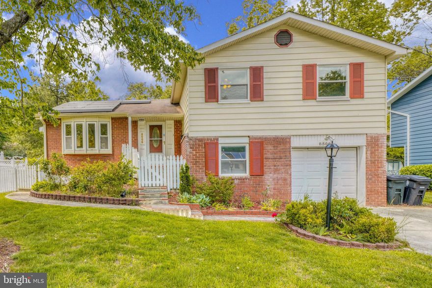 Welcome to 8506 Montpelier Dr!  A stunning 5 bed, 3 .5 bath split-level home with plenty of living space spread across multiple levels, and 2nd FULL kitchen and LAUNDRY in the basement! Main level featuring a spacious primary kitchen complete with extra cabinets and stainless steel appliances. Large family room boasts beautiful hardwood floors and large windows that let in plenty of natural light, creating a bright and inviting atmosphere. On the upper level you'll find the spacious primary bedroom with an ensuite bath, along with 3 additional bedrooms that share another full bath. Lower level of the home is perfect for entertaining, featuring a den/office, garage, 1/2 bath, and a 2nd family room complete with a cozy fireplace and access to a huge covered screened-in porch, providing the perfect spot for outdoor relaxation. Basement of the home is a real standout feature, with a full 2nd kitchen, 2nd washer and dryer set, a full bath, bedroom, and additional living space. This makes it perfect for use as an in-law suite, an additional living area, or even as a rental unit. The home has SOLAR PANELS and also features a large private fenced-in yard, providing plenty of space for outdoor activities and relaxation. With all of these features and more, 8506 Montpelier Dr is the perfect home for those seeking plenty of space and an excellent location in a quiet and friendly community. Don't miss your chance to make this home yours!