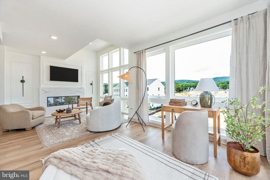 Rare opportunity to lease the builder’s fully upgraded Napa model, never lived in and impeccably finished. Offering over 2,500 square feet across the third and fourth floors, this residence is surrounded by oversized windows on multiple sides, creating exceptional light and an elevated, airy feel that sets it apart from typical condos.

The main level features a wide open kitchen, dining, and family room that feels more like a modern single family great room than a condo. A large center island anchors the space, complemented by high end finishes, upgraded cabinetry, premium appliances, and designer lighting throughout. A dedicated office on the main level provides ideal work from home flexibility. The home is completely turnkey with no decisions or projects required.

Upstairs, the primary suite offers a spa inspired bath and generous closet space, joined by two additional bedrooms, a full bath, and a versatile loft space that works beautifully as a second living area, lounge, or fitness space. The layout is both functional and refined, ideal for comfortable everyday living or entertaining.

This is a rare chance to enjoy a true builder model without the commitment of purchasing and without paying condo or HOA fees directly, allowing you to experience luxury living without ownership responsibilities. Professionally designed, brand new, and ready for immediate occupancy.