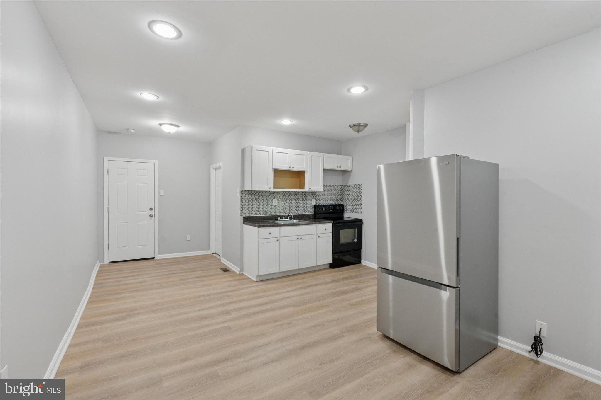 Welcome to 1809 W. Venango Street — a fully updated 6-unit apartment building in the heart of Tioga/Nicetown, just steps from Broad Street and convenient public transportation. This turnkey property offers a mix of three spacious 1-bedroom apartments and three efficiency units, providing excellent rental versatility and income potential. Each unit has been thoughtfully renovated with modern flooring, updated kitchens featuring white shaker cabinetry, sleek countertops, tiled backsplashes, and refreshed bathrooms with contemporary tile finishes. Recessed lighting and ceiling fans add both comfort and style throughout. The first-floor rear unit enjoys direct access to a private backyard—an attractive perk for tenants looking for outdoor space. The building is outfitted with a fire alarm system, separate meters for the 1-bedroom units, and utilities included for the efficiencies, simplifying management and reducing overhead. Currently, five units are vacant and ready for lease, while one 1-bedroom unit is already rented at $950/month. This leaves substantial upside potential for the next owner to bring all units to market rents. Situated close to schools, local parks, and major transit options, this property is ideal for both experienced investors and those looking to begin their real estate portfolio. Don’t miss the chance to own a high-demand, income-producing property—schedule your showing today and start building long-term wealth!