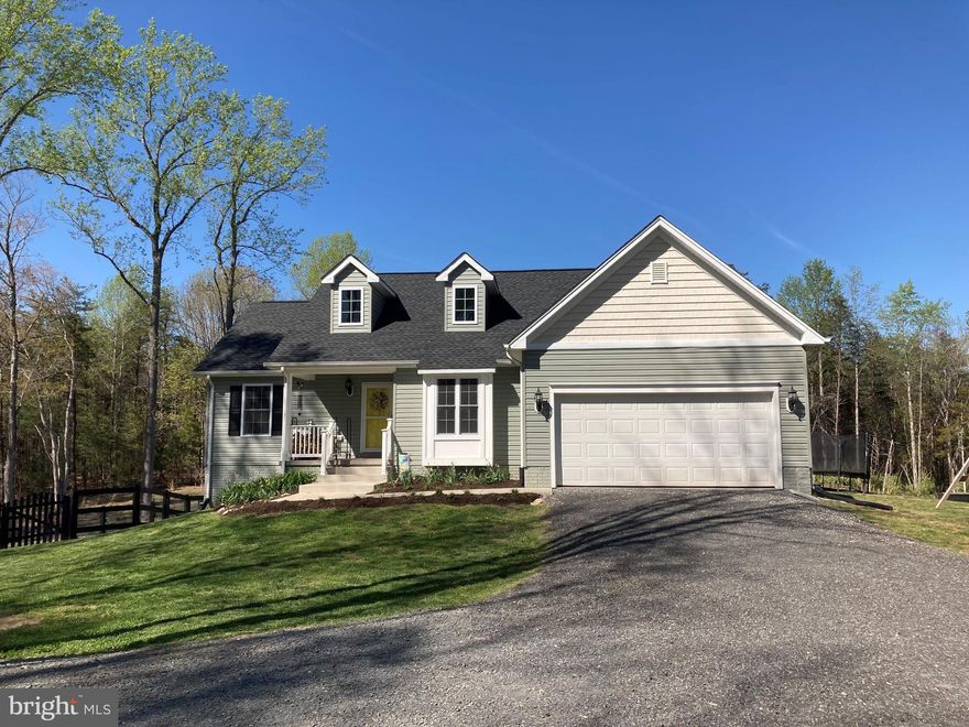 If you like your privacy, peace and quiet, this home is for you. Located on 5-plus, heavily wooded acres, you'll have all the quiet you desire. Head up the treed drive to this lovely home with a welcoming porch and landscaped front yard. Inside, you'll find an open floor plan with lots of windows and light. Kitchen with white cabinets, granite counters, huge pantry, and stainless appliances opens to dining area and living room beyond. Wood stove in living area makes for a cozy feel during colder climes, and windows facing the backyard and woods beyond open up the space. Take it outside to the great deck for a barbecue or dinner outside. Mother-in-law plan with master suite boasting tray ceiling, double vanity and walk-in closet. Internet included. Pets ok on case-by-case basis. **Resident must choose between two resident benefit packages at time of application.