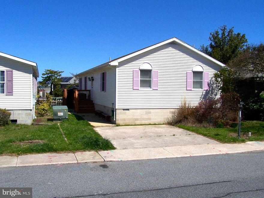 LOCATION, LOCATION, LOCATION!! Rare opportunity to own a waterfront home on one of the widest canals in Ocean City with only a 2-3 block walk to the beach! Also just a short walk to Ocean City's 58 Acre Northside Park, shopping, dining, the bus stop, and community amenities which include 2 inground swimming pools, 2 tennis courts, a 9 hole mini-golf course, a shuffleboard court, a pickle ball court, an 8- acre wildlife sanctuary/park area with large pond and a blacktop walking/jogging trail, and a bayfront boardwalk with 3 fishing/crabbing piers. This 3 Bedroom 2 1/2 bath home is move in ready and is being sold mostly furnished. Both full bathrooms have been updated with new ceramic showers. On the exterior this home features an outside deck, screened porch, a pier, a 7,000 lb remote control boatlift, a jet ski lift, and lots of storage. Call now to schedule your private showing.  Pontoon Boat conveys with property...1999 24ft. Sweetwater w/ Honda 90 hp motor. Low HOA fee of $415.00/year!!