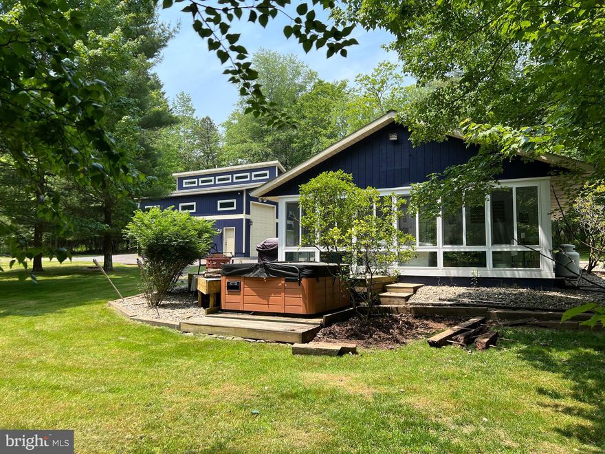 Check out this one of a kind lake escape and opportunity! If you're looking for a private, peaceful, turn-key lake access home with a dock slip this is it! Located off Turkey Neck Rd and a stones throw from the Deep Creek Yacht Club. This  Property contains a recently updated two bedroom one bathroom lake bungalow with a large yard, sunroom,  Living room, and hot tub. Also on site is an oversized detached garage with plenty of storage for toys and a separate  Mother-In-Law suite above with one bedroom, one bath, living room, and kitchen. Sale includes everything for your lake escape including a 2007 Premier Legend 24-foot pontoon boat, John Deere riding mower, and 2019/2020 Ez-Go custom 6-passenger golf cart for easy access to your new dock. The property has been lovingly maintained and includes recent updates of Mini-Split ductless A/C and heat for the house and garage. Call today before this one is gone!