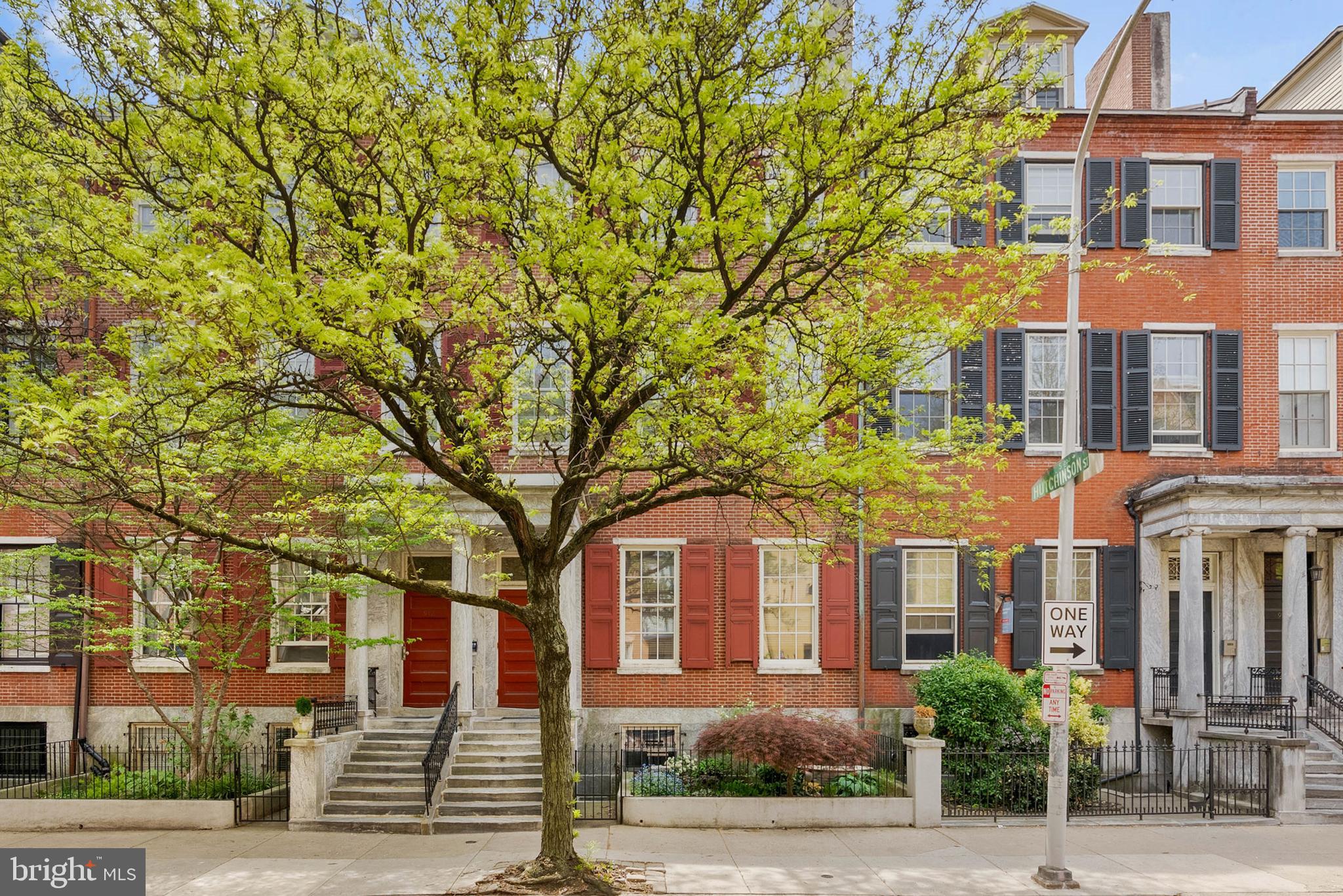 Located in a pridefully preserved condo building along the tree-lined Portico Row block of Washington Sq West, 914 Spruce St #9 is a large, extra-wide unit offering 2 bedrooms, 2 bathrooms, in-unit laundry, and a dedicated parking spot right out back. Out front, the property displays classic Philly architecture with a towering red brick facade, a vibrant garden, a marble portico, and a secure entry. Inside the unit, you're welcomed by a foyer with a deep storage closet. Beautifully aged hardwood floors extend into the expansive main living space that boasts soaring ceilings, a pair of tall windows, and a fireplace. There's plenty of room for hanging out and entertaining. The updated kitchen has generous cabinetry, granite counters, and a full suite of stainless steel appliances, including a dishwasher. Down the hall is a bright and airy primary bedroom suite with more picturesque windows, a walk-in closet, and an attached full bathroom. Completing the unit is a second bedroom with a custom closet, another full bathroom, and a laundry closet. Additional highlights include a parking spot that's accessed from the rear of the building, central a/c, gas heat, and gas hot water. 914 Spruce St's sought-after location earns a Walk Score of 95! It's only a few blocks from Center City, yet it has a small community feel. Local favorites like Habitat Coffee House, Kanella Grill, and Varga Bar are just steps away. Nearby 13th Street, known as Philly's restaurant row, features beloved spots including Little Nonna's, Vetri Cucina, Green Eggs Cafe, and Flambo. Enjoy sprawling green space at idyllic Washington Square Park, or stay active at Seger Park with its tennis court, dog park, and playground. A stroll down 9th leads to vibrant South Street, home to markets, shops, and eateries like Whole Foods and ACME. With Jefferson and Pennsylvania Hospitals within walking distance and a direct bus line to the University of Penn right on the corner, convenience is at your doorstep. Schedule your tour today!