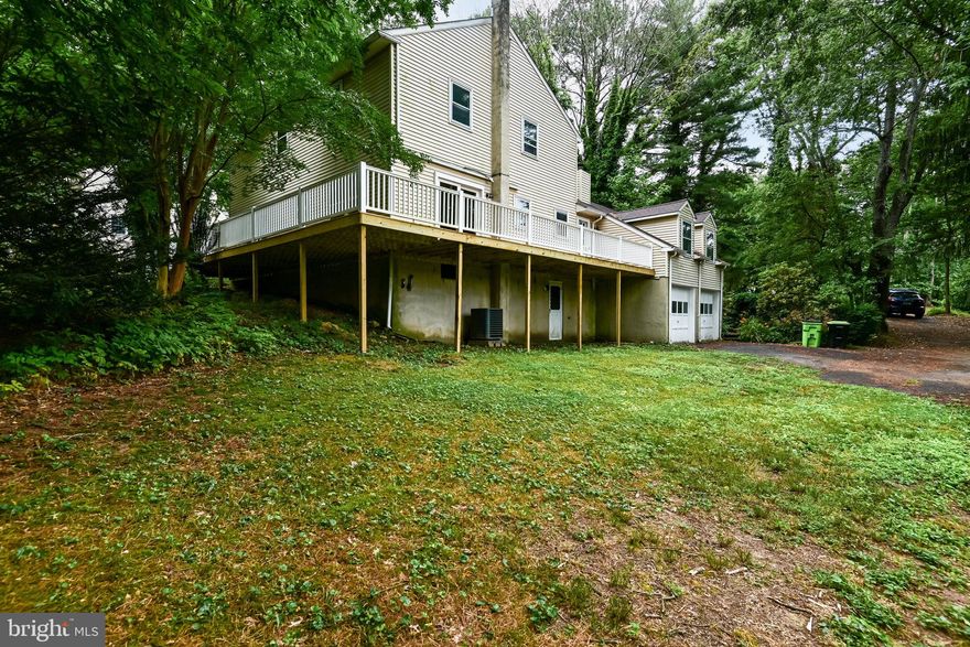 This charming four-bedroom, two-and-a-half-bathroom home exudes tranquility and warmth. Tucked away in a serene wooded area, it offers a perfect retreat from the hustle and bustle of daily life. The house boasts a spacious two-car garage and a delightful wrap-around deck, inviting residents to relax and enjoy the natural surroundings. The interior features ample living space, ideal for both entertaining and quiet family moments. The area surrounding the home offers a picturesque setting, with lush greenery and the peaceful ambiance of nature. Residents can enjoy outdoor activities like hiking and biking in nearby parks and take in the beauty of the changing seasons. Close to Fair Hill Nature Reserve, Carpenter Park, City of Newark and the University of Delaware. Additionally, the location provides convenient access to local amenities, including shops, restaurants, and schools, making it an ideal place to call home for those seeking a harmonious blend of tranquility and convenience.