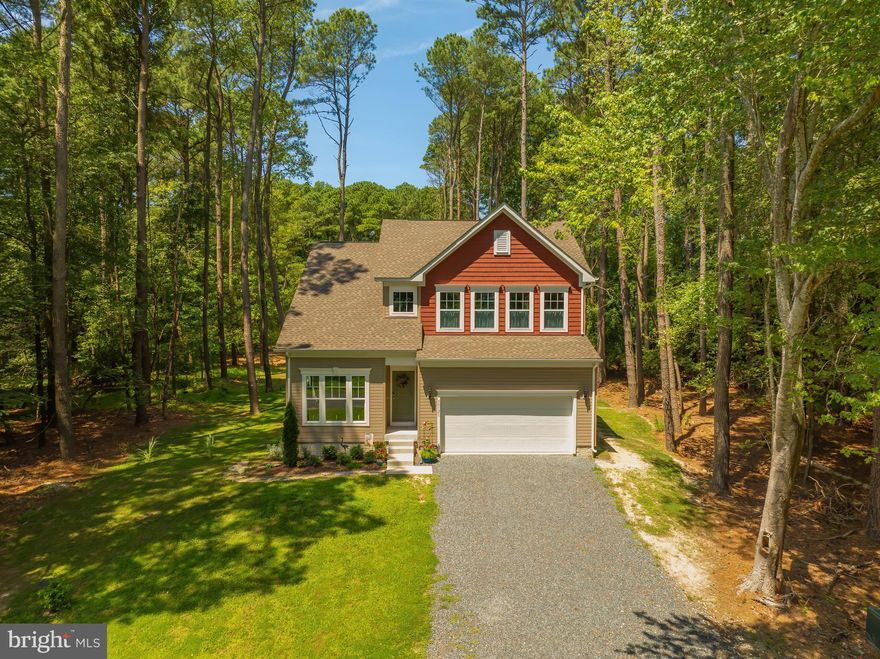 Beautifully built in 2023, this Gemcraft Rehobeth model has $80,000 worth of extras. It has 3 bedrooms, 2.5 bathrooms and is located in the amenity-rich Captain’s Cove Golf & Yacht Club. The views of the Chincoteague Bay are amazing, and per seller, nothing can be built across from the property so nothing will ever be in the way of the view! The open-concept layout features a first-floor primary suite, as well as a 2nd floor ensuite,  and laundry room, a large kitchen with island seating and stainless steel appliances, and a versatile upstairs loft that can serve as an office or flex space. Enjoy over 2,100 square feet of living space, a two-car garage, recessed lighting, walk-in closets, a cozy fireplace for the winter, and a screened in porch for the nicer days. Located on a quiet street near the golf course, this property offers access to a wide range of community amenities, including indoor and outdoor pools, a boat ramp, fitness center, walking trails, marina, and more. Just a short drive to Chincoteague Island, Assateague beaches, and local shops and restaurants. Whether you’re looking for full-time living or a weekend escape, this home offers the perfect balance of space, comfort, and coastal charm!