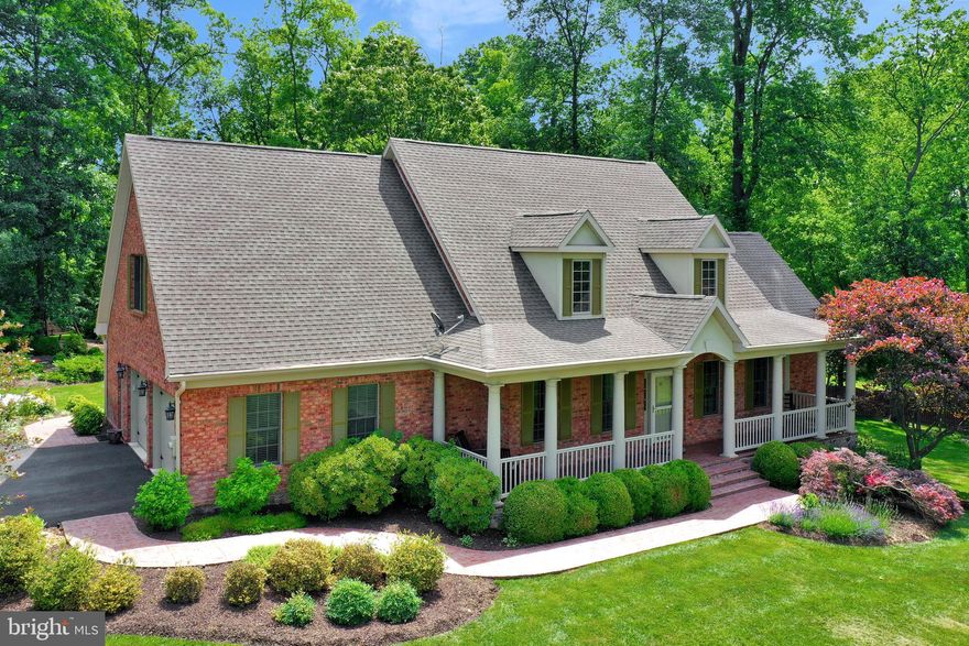 A rare opportunity to own a spectacular all brick custom built home hidden from the maddening crowds of DC/Northern Virginia, but still convenient to the Metro and just minutes from the Historic Villages of Charles Town, Harpers Ferry and Shepherdstown. Combining elegance and comfort, this home captures the essence of fine living. Features  in this 4 bedroom, 4 1/2 bath home with 2 car garage include 9' ceilings on main level,  gourmet kitchen with granite countertops, stainless steel appliances, wide plank hardwood floors, living room with gas fireplace with stone surround,main level master bedroom with hardwood floors, tray ceiling, master bath has double vanity with granite countertop, roman tub and shower. Sunroom  off of living room features palladin windows and ceramic tile flooring.  Upper level has a second master bedroom with attached bath, two additional bedrooms and bath complete this level.  Lower level features exercise room, game room, wet bar and media room.  Covered porch on rear with brick flooring  and professional landscaping with irrigation system are added features.  Must see online matterport vitural tour to appreciate all this property has to offer.