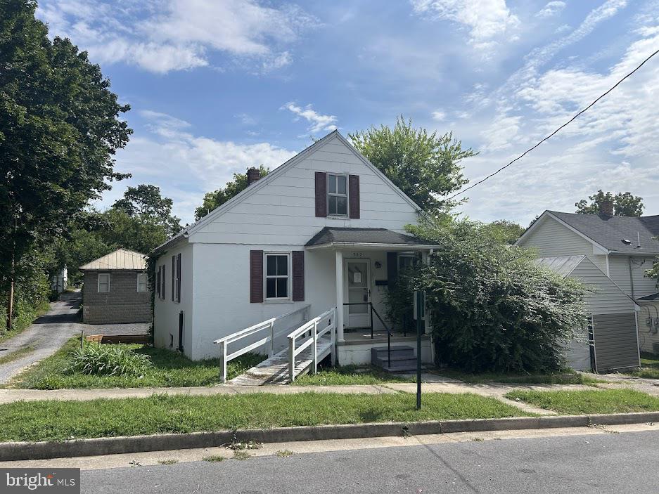 Multiple Offers have been received and Highest and Best Deadline Scheduled for Wednesday 8/20/25 at 4PM. Cute Bungalow in Downtown Martinsburg! One main level bedroom, and two more in the upper loft area. Basement area for storage, and a parking spot in the rear of the home. Mini split system in the living room, and oil furnace in the basement. Perfect for an investor as it needs a rehab and will not go any typical mortgage products. Needs cash or rehab financing.