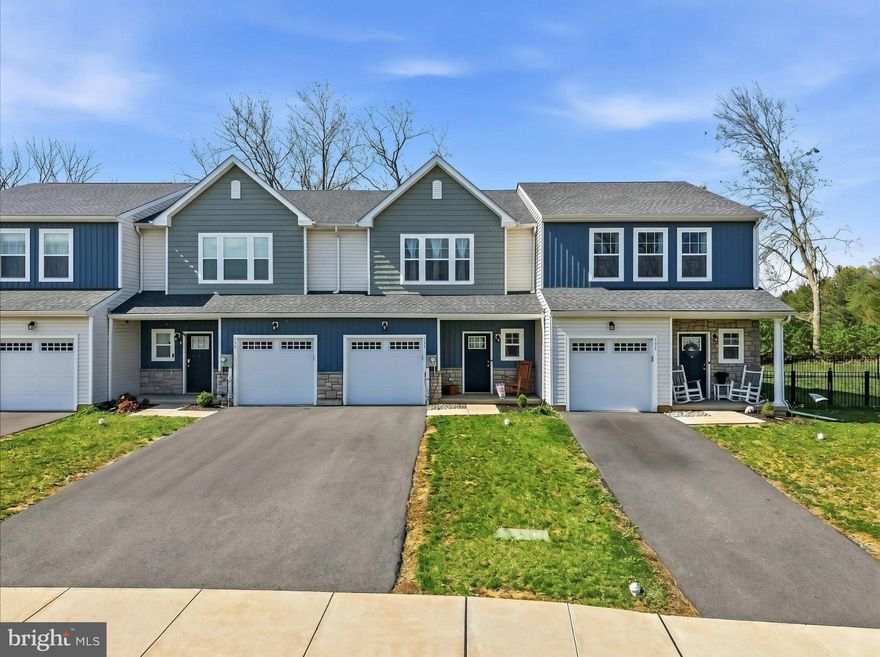 Welcome to 133 Scotty Drive in the highly sought-after Wolfs Run community - where modern design, thoughtful upgrades, and low-maintenance living come together beautifully. Built in 2023 by Tuskes Homes, this impeccably maintained Dakota model offers 3 bedrooms, 2.5 baths, and over 1,500 square feet of bright, open living space - all set on a premium lot backing to green space and fenced in yard.. Step inside to a sun-filled, open-concept main level designed for both everyday living and effortless entertaining. The kitchen is a true standout, featuring white shaker cabinetry, stainless steel appliances, abundant counter space, a pantry, and a spacious center island with seating. It flows seamlessly into the dining area and expansive family room, where recessed lighting and large windows create a warm, inviting atmosphere. Sliding glass doors lead directly to your private outdoor retreat. Outside, enjoy a fully fenced backyard - an exceptional and rare upgrade in this community - complete with a concrete patio ideal for relaxing or hosting. With peaceful views, you’ll appreciate both privacy and a sense of tranquility. Upstairs, the spacious owner’s suite offers a comfortable retreat with multiple windows, a walk-in closet, and a private en-suite bath featuring an oversized vanity and a glass-enclosed shower. Two additional bedrooms are generously sized and share a well-appointed hall bath. A convenient second-floor laundry area adds to the home’s smart, functional layout. Additional highlights include luxury vinyl plank flooring throughout the main level, neutral finishes, central air, efficient forced air heat, a built-in one-car garage, and a private driveway. Built on a slab, this home offers true low-maintenance living with no basement to manage. Ideally located in Palmer Township within the Easton Area School District, Wolfs Run offers easy access to major routes, shopping, dining, and everyday conveniences. Why wait for new construction when this move-in ready home already includes the upgrades you want - fencing, patio, and a premium lot - without the added time or expense? Clean, modern, and turnkey, 133 Scotty Drive is ready to welcome you home.