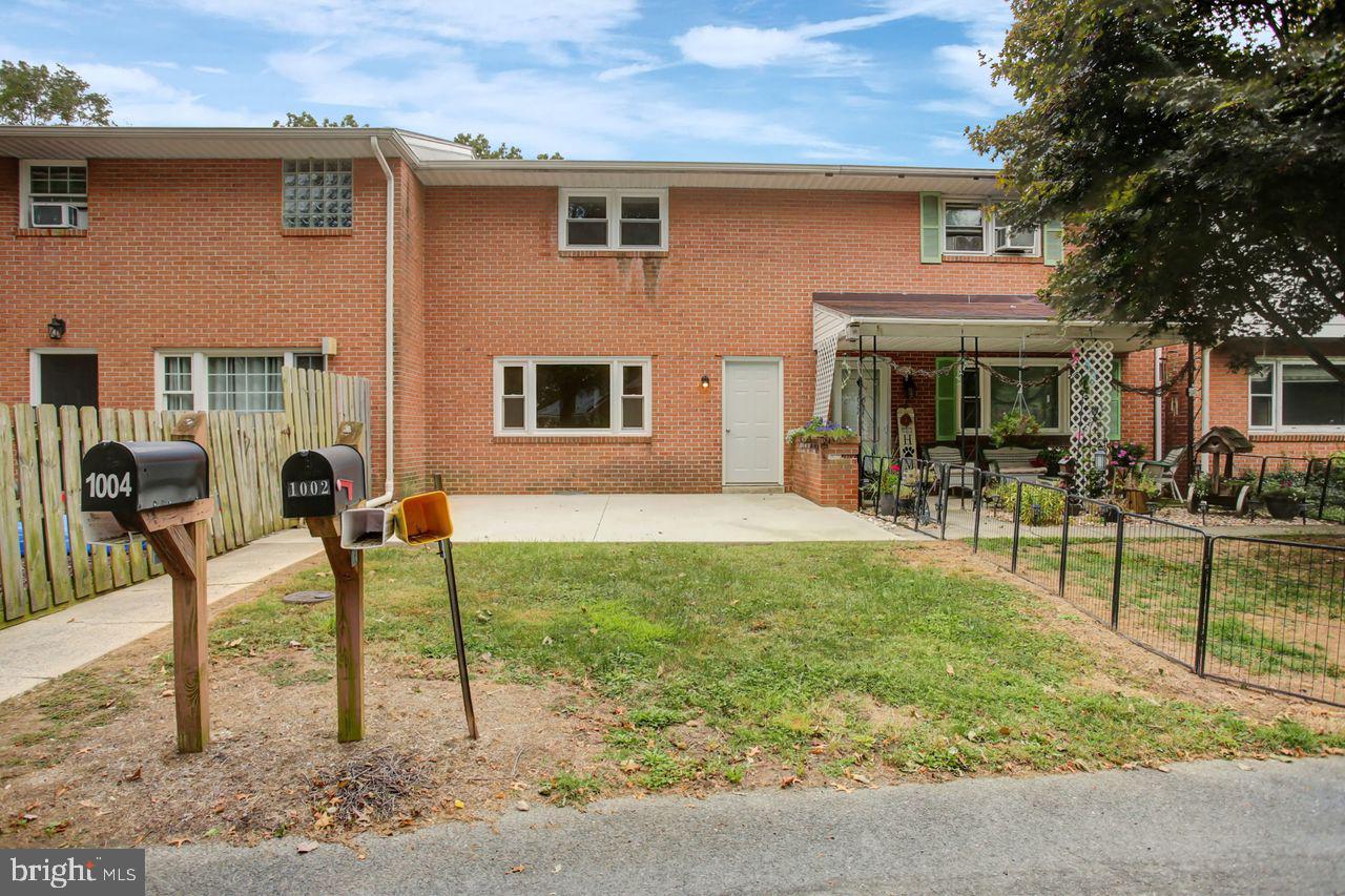 Great Starter Home! 2 Bedroom 1 bath Townhome with beautiful refinished hardwood floors in bedrooms and living room, replacement energy efficient windows throughout, and a beautiful remodeled bathroom. Spacious kitchen with range and refrigerator; Electric baseboard heat, 2 Car off street parking and one car garage; W/D Hookups in basement.