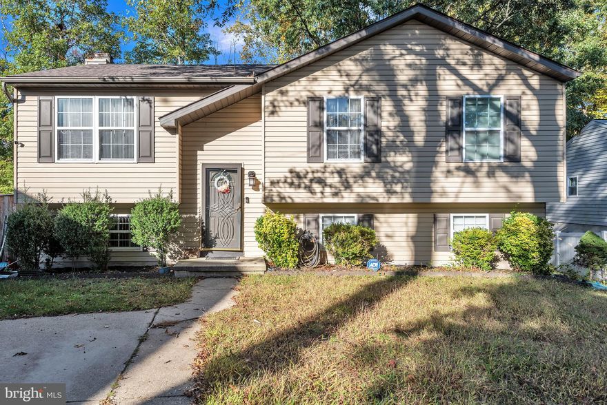 Beautiful 3 bed, 2 bath split level home with an elegant feel nestled in a desirable, quiet neighborhood. STILL OWNED BY THE ORIGINAL OWNERS. No wear and tear! Upon entry, you will be impressed with sophisticated banisters that run up and down stairs. The main floor is an open concept allowing conversation and people to flow from room to room with ease. The gourmet kitchen will make you swoon with cherry cabinets, granite countertops, tiled backsplash, and an island that offers an overhang for additional stool seating. The stainless steel appliances, including the massive refrigerator and fan above, demand attention. Primary bedroom has an en suite bathroom with a tub/shower. Remaining bedrooms are spacious and can fit queen sized beds. The hallway bathroom is updated with tiled walling, sleek glass door on the shower, and bright white touches. The lower level makes for a great living room. The space is large enough to accommodate an office area or play/ rec room. There is a fireplace for the cold months! Moving outside, there is a large sunroom at the back of the home, perfect for entertaining year round. Below the sunroom is a great sized deck. The backyard is fenced in and offers the perfect natural oasis. Concrete slab driveway requires little maintenance. The roof is only three years old! Close to Ft. Meade.