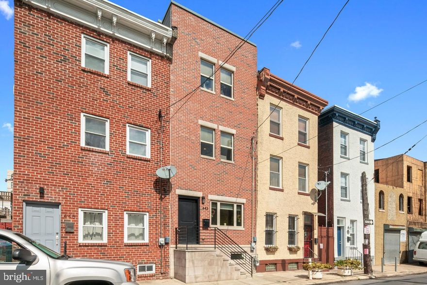 Amazing location in the booming Old Kensington neighborhood! This 3 year old construction features 3 stories, a finished basement, a large back patio and a full roof deck with Center City views and an ABATEMENT! It all starts as you walk into an open floor plan with warm and greeting real Ash wood flooring. The living room naturally flows into the dining room area. The modern and contemporary kitchen is massive and features custom cabinetry with a pantry, white quartz countertops, stainless steel appliances with gas stove and built in microwave. The kitchen also offers a large peninsula for additional breakfast bar seating and countertop space. From the kitchen you have access to your large private maintenance free patio with vine growing on the fence. The kitchen also leads you to the full finished basement where you will find the media room with a custom built storage cabinet system accented by a reclaimed wood wall. The media wall has all of your TV wires fished through the wall for a seamless entertainment system. The full basement also offers great storage, a nook in the back for office space and a modern half bath. Upstairs on the second floor you will find the wood flooring continued along with 2 bedrooms and a large hall bath with a full sized tub. The 3rd floor features the master suite with convenient laundry room with washer and dryer included. The master bedroom is spacious and bright and offers a walk in closet. The master bath is extremely large and offers a double vanity, great storage and a marble top bench in the shower. From there head upstairs for the ultimate entertaining area on the full size roof deck with Center City Views. The roof deck comes with outdoor area rugs and furniture which is included! You will absolutely LOVE living in this home and neighborhood. Directly across the street you have a great dog park. 2 doors down you have one of the best taco joints in the city in Taco Riendo. Around the corner is one of the best restaurants in the city in Helm. A block away you will have unlimited summer fun in Cruz Playground with basketball courts, a public pool, a large park to play soccer softball and much more. Within minutes walking to all the attractions of Northern Liberties on 2nd Street including ACME supermarket and The Piazza. Less than 10 minutes walking to Fishtown's Frankford Avenue and Frankford Hall, La Colombe, Suraya and so much more! Less than 10 minutes walking to the Girard EL stop! Close to I-95 access and other public transportation on Girard Avenue. This home is a Walker's Paradise with a walk score of 93! Schedule your showing today! All square footage numbers are approximate and should be verified by the buyer.  It is the responsibility of the buyer to verify real estate taxes. Seller is a licensed real estate salesperson.