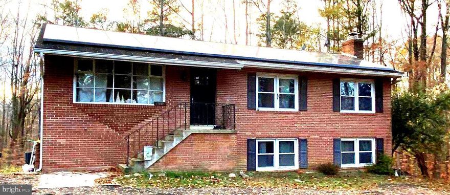 Private 10.6 acres -  lovely country setting.  All brick home.  Home is being spruced up.  Kitchen was remodeled in 2012.  Stamped concrete patio off walkout basement,  Office/playroom in basement; as well as a large family room with wood-burning stove insert. Solar panels on roof.  Photos coming soon Home is in the process of being cleaned up.  With some TLC this would be a great investment.