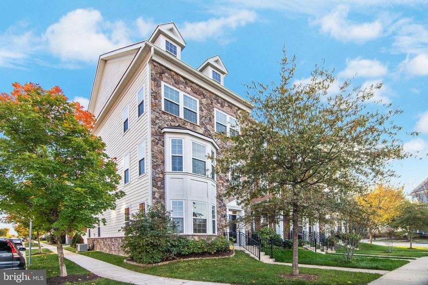 **JOIN US FOR LIGHT REFRESHMENTS AND A SAFE PERSONAL TOUR AT OUR GRAND OPEN HOUSE ON SUNDAY, 10/25 FROM 11 AM TO 2 PM** AMAZING OPPORTUNITY TO OWN IN THE DESIRABLE SHIPLEY'S GRANT SUBDIVISION IN HOWARD COUNTY!  ENJOY SEEING THIS GEORGEOUS STONE FRONT END-OF-GROUP, TRUE, 3 LEVEL, 2 CAR GARAGE, 2 CAR DRIVEWAY, 3 UPPER LEVEL BEDROOMS AND 2 UPPER LEVEL FULL BATH TOWNHOUSE.  ORIGINALLY BUILT BY BOZZUTO HOMES, THIS ELEGANT HOME IS SITUATED ON AN UPGRADED ELEVATION WITH A FLAG LOT AND SCENIC TREELINED VIEWS.  FALL IN LOVE WITH ALL THE EXTRA SUNLIGHT AFFORED BY A NORTH EAST FACING FRONT WITH MULTIPLE BAY WINDOWS ON THE EAST SIDE OF THE HOME.  RELISH THE FRONT AND PARTIAL SIDE STONE MASONRY SIDING WITH THE TWO FRONT FACING DORMERS!   WALK INTO THE EXTRA WIDE ENTRY FOYER THAT LIES JUST NEXT TO THE LOWER LEVEL BASEMENT RECREATION / OFFICE / BONUS ROOM WHICH IS CONVIENTELY WIRED WITH A MOUNTED TV AND SPEAKER SYSTEM.  OR TURN IT INTO AN ENTRY LEVEL BEDROOM!  APPRECIATE THE NEWER BERBER CARPETS THROUGHOUT ALL INTERIOR STAIRWELLS.  TAKE NOTICE OF THE ENTIRE 2ND LEVEL HARDWOOD FLOORS AND NEWER ENGINEERED HARDWOODS ON THE 3RD LEVEL HALLWAY.  BRAND NEW CARPETS & CEILING FANS/LIGHTS IN ALL BEDROOMS.  OBSERVE THE GOURMET KITCHEN WITH ALL STAINLESS STEEL APPLIANCES, INCLUDING A DOUBLE OVEN WITH GAS RANGE, GRANITE COUNTERTOPS, AND CENTER ISLAND WITH BREAKFAST BAR.  TAKE ADVANTAGE OF THE UPPER LEVEL STAINLESS STEEL WASHER AND DRYER.  NO MORE DRAGGING DIRTY CLOTHES UP 2 FLIGHTS OF STAIRS!  TAKE PLEASURE IN KNOWNING THIS METICOULSLY MAINTAINED HOME HAS UPDATED FIXTURES TROUGHOUT THE HOME INCLUDING NEW GARBAGE DISPOSAL AND LIGHT FIXTURES IN ALL BATHROOMS. **** DON'T MISS THIS OPPORTUNITY TO GET A TRULY MOVE-IN READY HOME!  MAKE USE OF THE REAR FACING BALCONY WITH GRILL THAT WILL CONVEY AS WELL! ALSO CONSIDER THE 2 OUTDOOR COMMUNITY POOLS EACH WITH ITS OWN CLUB HOUSE.  HOME IS CONVENIENT TO SHOPS, REASTURANTS , MAJOR HIGHWAYS AND OTHER AMMENITIES.  COME TAKE A LOOK IN PERSON OR VIEW THE VIRTUAL VIDEO WALK THROUGH TODAY!