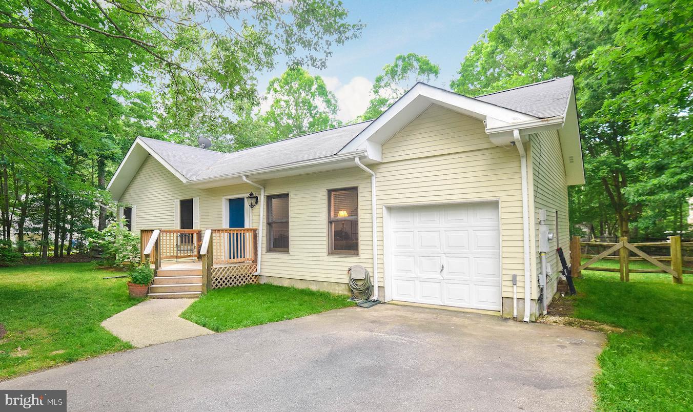 Peaceful & Private describes this home and location! The foyer opens into the family room with views into the dining room and kitchen. Vaulted ceilings with beams and skylights allow for a spacious and light feeling throughout the main area of the home. Luxury vinyl flooring in both the kitchen & dining rooms. The kitchen has a laundry/pantry area conveniently located just off of the garage. The back door in kitchen opens to the deck great for a morning cup of coffee or evening cookouts. The back yard is fenced and private. This home has 3 bedrooms and 2 full bathrooms and sits on just under an acre. The master bedroom is large with vaulted ceilings, walk in closet and master bath. There is also a door leading out to the deck from the master bedroom. The one car garage allows for parking and storage space with pull down attic storage. New Roof and skylights. Golf & Pool memberships are available through the Breton Bay Golf & Country Club. Beach access is also available for $50 per year through the Breton Bay Civic Association. Beach area includes a pier, playground, and pavilion area. Close to schools, shopping and downtown Leonardtown.
