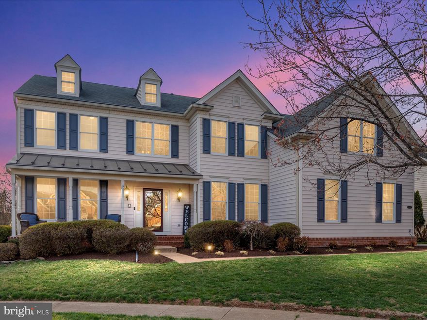 Welcome to this stunning and rarely available Harvard model in the prestigious and highly sought after Dominion Valley County Club! This beautiful home boasts of 5 bedrooms, 4.5 bathrooms, 3 car side load garage, fully finished basement and is the perfect blend for modern day living and style. You will be impressed by this premium lot that sits on quiet cul-de-sac and this lot has an amazing backyard which backs to the woods for privacy. As you approach the home, you will be welcomed by the covered front porch and meticulously landscaped property with great curb appeal. With over 5,500 square feet, this home is immaculately maintained and move in ready for the new owners. The impressive grand foyer is elegant with the beautiful staircase to the upper level. The main level offers a spacious office with french glass doors and built-ins, formal sitting room and dining room, culinary kitchen, solarium with skylights and grand family room with vaulted ceilings. This culinary kitchen includes stainless steel appliances, double ovens, gas cooktop, granite countertops, custom quality cabinetry, impressive tile backsplash and large center island. The solarium/ sunroom extension provides additional entertaining area for your guests. Enjoy the breathtaking views from huge composite deck with pergola overlooking the spacious backyard with steps to brick patio on one side and to the driveway on the other side. Relax in the large sun-filled family room with stunning wall of windows, cozy gas fireplace and a second staircase leading upstairs. In addition, the main level includes a spacious laundry room and remodeled powder room. The upper level includes the luxurious primary suite with tray ceiling, huge sitting room, second gas fireplace, dual walk-in closets and remodeled en-suite bathroom with an oversized shower, separate soaking tub, modern double bathroom vanity, and private water closet. The remodeled Princess Suite is perfect for your guests with its own private en suite bathroom. In addition, bedrooms three and four are joined together by the Jack and Jill bathroom. Enjoy entertaining your guests in this fully finished lower level with a large recreation room, custom kitchenette/bar to make your favorite cocktails, large bedroom and full bathroom, gym room, and a spacious storage/utility room. Enjoy the walkout basement to the brick patio and the lovely backyard that backs to the woods. 

Recent property enhancements include but not limited too: New EV Charger (2024), Custom Trim Surround Fireplace in Family and Primary Bedroom (2024), Remodeled Primary Bathroom (2024), Remodeled Princess Suite Bathroom and Powder Room (2023),  Renovated Guest Room and Gym Room (2023), New Laundry Room Floors (2022), Repaved Driveway (2022), New Washer and Dryer (2022), New Refrigerator and Double Ovens (2022), New Sump Pump (2022), New Fireplace Log Insert (2022), New Ceiling Fans (2022), New Lower Level AC (2019), New Humidifier (2019), New Upper Level AC (2018), and New Hot Water Heater (2018). 

Enjoy the resort style amenities at the Dominion Valley Country Club which include 
Arnold Palmer Signature Golf Course (memberships available to residents), country club, 4 outdoor pools, indoor pool, sport pavilion, exercise facility, walking trails, fishing ponds, sports courts and so much more. Come and enjoy the lifestyle offered by the Dominion Valley Country Club. Conveniently located and walking distance to grocery stores, restaurants, and shops. Schedule your showing today as you do not want to miss the opportunity to call this your forever home!