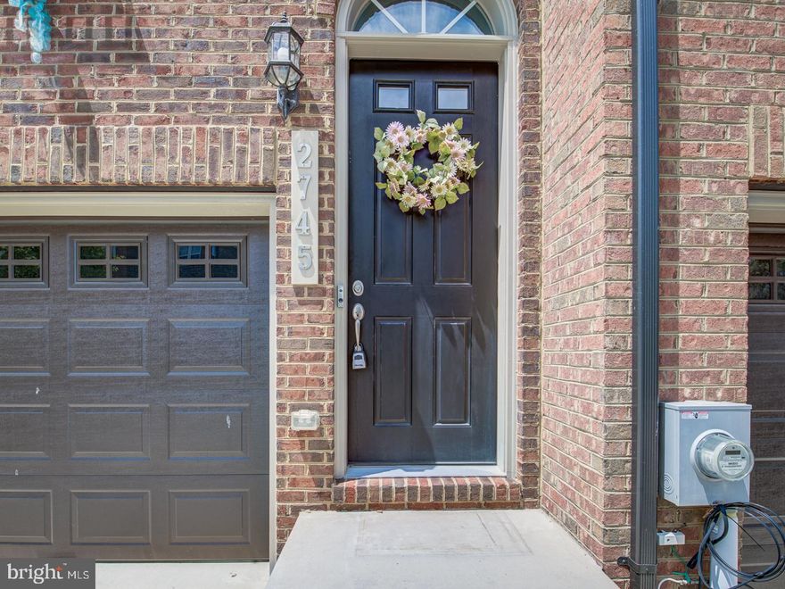 This is a practically 'new' townhome, located in the well-sought out Hamilton Park, The entrance way has a grand and welcoming front door. The property was built in 2019 and is move-in ready! The main level has an open great-room feel that flows throughout the living/kitchen/dining spaces to a spacious deck off the rear. This main level features a large 10'  center kitchen island, upgraded quartz countertops, Energy Star stainless steel appliances: gas cooktop, self-clean double ovens, built-in microwave, dishwasher, upgraded 42" cabinetry, pantry, upgraded 5" laminate plank flooring, oak stairs, 9 ft. ceilings, and a powder room/half bath. The upper level features 3 bedrooms and 2 full baths. The owner's suite has a spacious walk-in closet, an ensuite shower bath with dual vanity, a water closet, upgraded ceramic tile. The laundry is on the top floor with the bedrooms. The lower level features a rec room with upgraded with laminate plank flooring, lower level half bath, large windows, slider door, 9 ft. ceilings. It also has the 2nd powder room/half bath. It is accessible at the rear and from the 2-car garage. Many, many convenient dining and retail shopping options nearby. Easy access to US-301 and Andrews AFB.