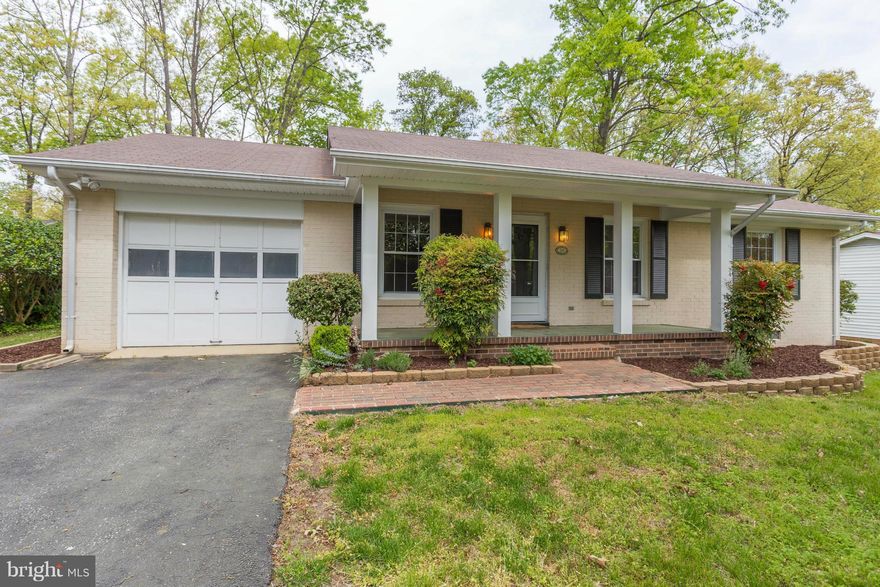 No carpet! No vinyl floors! All hardwood & ceramic tile. VRE Fredericksburg station only 3.8 miles, or 8 minutes, away.  Very close to all shopping, dining, prof offices, Rt 1 & I-95. All brick. Level yard. Fenced back yard. Shed. Paved driveway & garage. Sep laundry rm w/ tub sink. Family rm off kitchen. Sun room off kitchen. Master bedroom w/full master bathroom. Community swimming pool. No HOA.