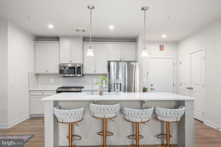 Welcome to this stunning 2024-built second floor condo that still feels brand new. Step inside to sleek LVP floors and an open floor plan filled with natural light. The bright and airy kitchen features white cabinetry, stainless steel appliances, and a large center island—perfect for cooking and entertaining. Recessed lighting throughout adds a modern touch, while the living area opens to a private balcony with peaceful community views.

Enjoy two generously sized bedrooms, including a spacious primary suite with a walk-in closet and a stylish ensuite bath. Assigned garage parking (space 1-17) adds convenience and ease.

Located in a vibrant new community just minutes from Dulles Airport, the Dulles Expo Center, Sully Plaza, and major commuter routes, this home offers easy access to everything you need.