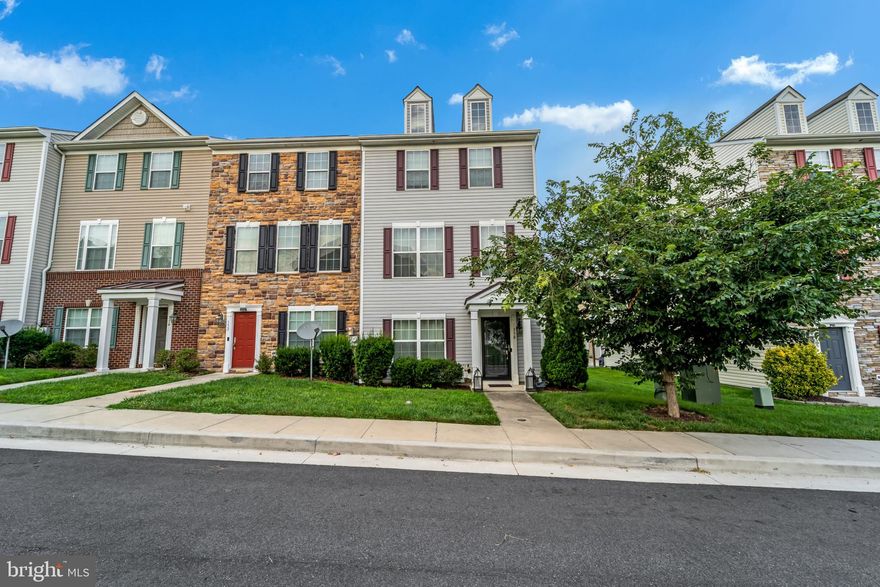 Welcome home to this beautiful End of Row Townhome in Charlestown Crossing! You'll have plenty of room to grow with 3 bedrooms, 3.5 bathrooms, and over 2,000 sq ft of space! Beautifully landscaped with foundational bushes and arborvitae trees that frame the front door, along with with a covered front porch with stately pillars. Walk into a light and bright first level foyer that features hardwood floors, a half bath, and bedroom that can also be used as a home office! Walk up the steps to the main level that features crown molding and hardwood floors that flow throughout. The combination living and dining room has streams of light flowing in and a 5 light chandelier that hangs above the formal dining room. The spacious kitchen features recessed lighting, plenty of cabinet space, and a generous amount of granite countertop space with an L shaped countertop and a center island with breakfast bar. Additional barstool height counter gives even more space to enjoy everyday meals. The kitchen also features a double sink, closet pantry, and all stainless steel appliances, including a double door fridge with ice maker. Enjoy leisurely meals in the neighboring breakfast nook with a three light chandelier. Relax afterwards in the adjacent family room with access to the sliding glass doors leading to the upper level deck - the perfect place to BBQ! Escape to the main bedroom suite that features a double door entrance, vaulted ceilings, cooling ceiling fan, and large closet space. The en-suite bathroom has a soaking tub, stall glass shower and double sink vanity. An additional bedroom and hall bath complete the level. Convenient laundry room on first level that features a full size Whirlpool washer and dryer. You'll have plenty of space to park with the attached 2 garage and long paved driveway. Minutes away from the North East River and Elk Neck State Forest. Easy access to US-40 and 95, and close to multiple shopping and dining destinations. Do not miss this one!