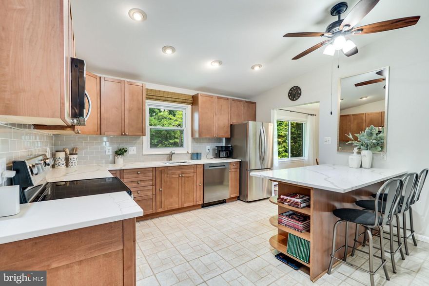 *Roof is 5 years old with gutter-guard
*HVAC with humidifier is 3 years old
*New A/C unit 2022
*New Water heater 2023
*Updated kitchen with Quartz counter top and New stainless appliances 2023
*Upper hall bathroom renovated in 2022
*Primary ensuite bathroom renovated in 2023
*Main level bathroom renovated in 2023
*New carpet on upper and lower levels 2023
*Sprinkler system
*Spacious 2-car garage with storage space   
                                                                                                                                                                                                                                                     
                                                                                                                                                                                                                                          Welcome to this charming multi-split-level home situated on a spacious .30-acre lot within a tranquil cul-de-sac in the desirable Cherry Run community. Boasting an expansive backyard adorned with meticulously maintained landscaping and an in-ground sprinkler system, this property offers an oasis of tranquility.
                                                                                                                                                                                                                                                    

This home has four bedrooms, three bathrooms, and ample space for comfortable living. Additionally, a bonus room on the lower level offers versatile usage options; whether you envision it as an extra bedroom, an office, or a craft room - the choice is yours!

The main level greets you with a welcoming ambiance, comprising an open living room, an elegant dining room enhanced by a cathedral ceiling, and a well-appointed kitchen. The kitchen has been thoughtfully updated with new countertops, a stylish backsplash, and stainless appliances, ensuring a delightful culinary experience.
                                                                                                                                                                                                                                                      

This home has recently been renovated, including fresh paint and new carpeting on the upper and lower levels. All three bathrooms have been tastefully updated with modern finishes, presenting a sleek and contemporary aesthetic. 
                                                                                                                                                                                                                                                      
Key updates to the home's infrastructure include a five-year-old roof with a gutter guard system, a three-year-old HVAC system with a humidifier, and a one-year-old air conditioning unit. Additionally, a new water heater has been installed, ensuring comfort and convenience for years to come.
                                                                                                                                                                                                                                                     
Situated in the highly regarded Lake Braddock High School district, this home provides excellent educational opportunities for families. The Cherry Run community is a well-established neighborhood known for its inviting atmosphere and convenient proximity to various shops and restaurants, all within easy walking distance.
                                                                                                                                                                  
Take the chance to make this meticulously maintained and thoughtfully updated home your own. Schedule a showing today and take advantage of the opportunity to create comfortable living in this location.