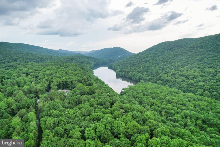 Tucked away in the mountains of Central Pennsylvania is a one-of-a-kind gem! There is so much variety in nature, but rarely do you find a property that offers so much beauty and variety, all in one place as what you will have here. There are 221 acres, miles of ATV trails, large streams, 2 cottages, and a pond. Only 20 minutes from Shippensburg, you will find this remote Hideaway, traveling back a long private lane, and entering the home site with two cottages joined by landscaping and hardscape for gathering for cookouts or around the fire pit. Boarding the home site is a small pond and one of the property’s streams. The cottages are both fully equipped with a kitchen, bedrooms and full bathrooms. Pinewood Cottage, with 720 square feet, has high end finishes including the kitchen cabinets, quartz countertop, solid yellow pine flooring, stainless steel appliances, and a wood stove on a stone hearth. Fern Forrest Cottage, with 768 square feet, has one bedroom, a full kitchen and a full bathroom with laundry. Other amenities include a sawmill building(40’x30’), a workshop/garage(30’x60’), and a 125 yard shooting range. In the warm season the property is adorned with ferns for as far as the eye can see. The large stream leads into the Letterkenny Reservoir where you can enjoy boating and fishing. This is a truly unique property that offers so many natural features within its 221 acres! This property is at the end of a private lane, with a security gate and 24 hour video surveillance. Trespassing is stictly prohibited. Scheduled appointments are the only way to legally access the property!