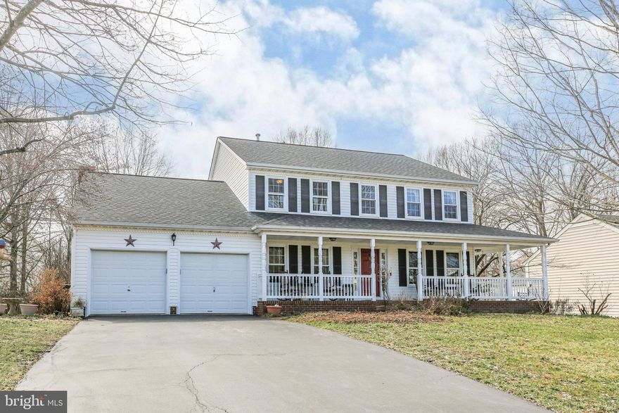 Welcome to your new home in the highly sought-after Fox Point neighborhood! This charming colonial with a wrap porch, seamlessly blends comfort and modern living.
On the main floor, you'll find a spacious office, a formal living room, and a generously sized dining room. The kitchen features a central island, stainless steel appliances, and a cozy dining area. Step down into the large family room, where abundant natural light and a wood-burning fireplace create a welcoming atmosphere.
Upstairs, new carpeting leads to the primary bedroom, complete with a walk-in closet and an en-suite bathroom featuring a walk-in shower, soaking tub, and double vanity. Three additional bedrooms and a hall bathroom complete the upper level.
The finished basement offers a fifth bedroom, a full bathroom, and a large recreation room, which includes built-in shelving on one side. An unfinished room provides ample space for a craft room, storage, home gym, or anything you can imagine.
Step outside to the large backyard or explore the vibrant community, which boasts amenities such as a refreshing outdoor pool, basketball courts, and playgrounds – perfect for endless family fun.  Recent upgrades include: roof 2018, gas water heater '22, AprilAire humidifier '23, Samsung range '21, Frigidaire microwave '22.  Windows and French doors 2017