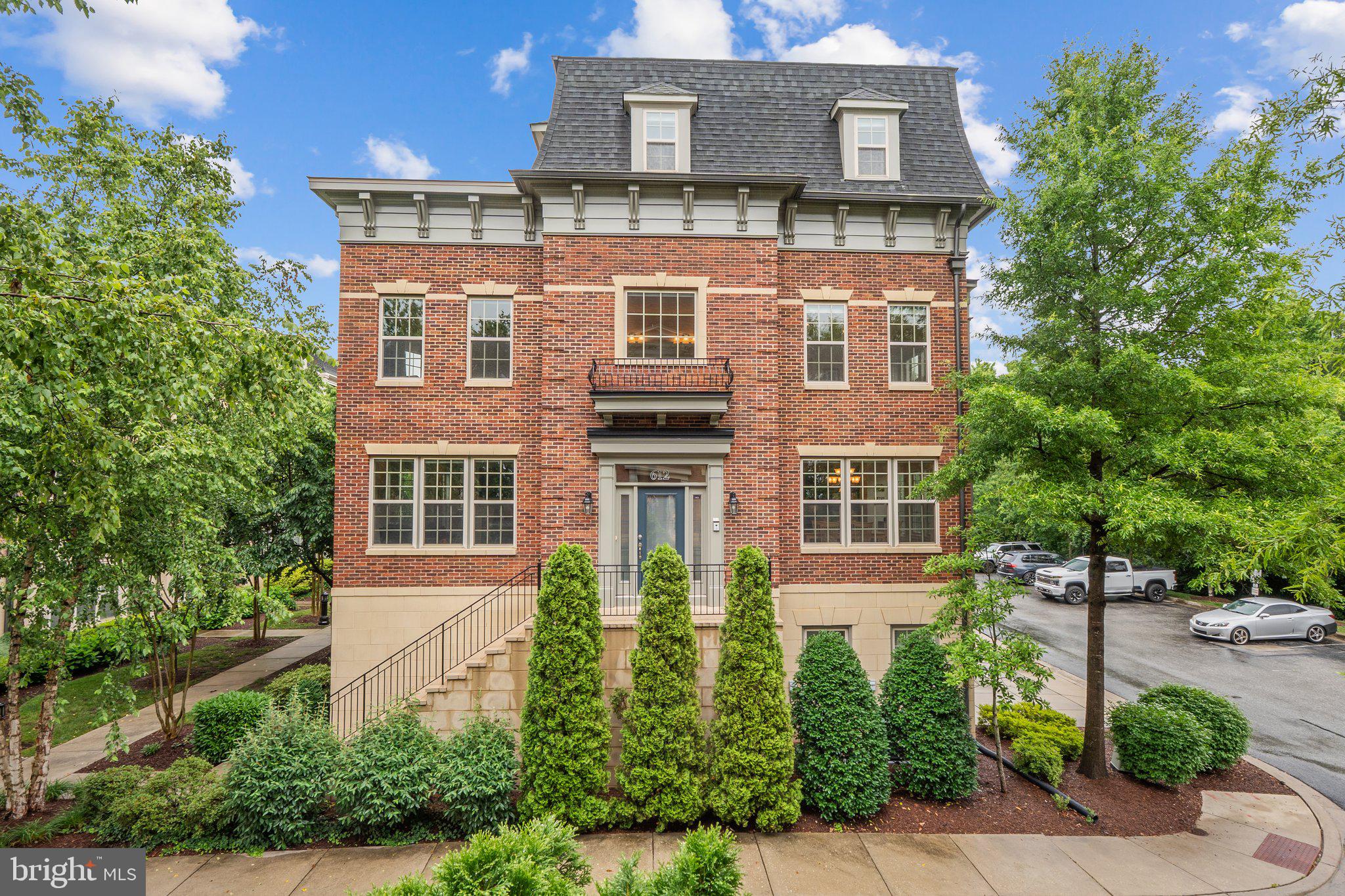 Rare End-Unit Luxury Townhome in Gated Potomac Overlook at National Harbor
Welcome to one of the largest and most impressive homes in the exclusive Potomac Overlook community—available for the first time since construction just 12 years ago. This stately, oversized end-unit townhome is packed with premium upgrades and is located in a quiet, gated enclave steps from National Harbor's vibrant dining, entertainment, and waterfront trails—yet minutes to D.C., Old Town Alexandria, and major commuter routes.
Striking Curb Appeal & Grand Entrance
Set apart by its stately side entrance, brick façade, and stone steps, this home boasts a unique and commanding presence. A generous landing welcomes you to the largest model in the neighborhood, offering unmatched privacy and natural light from multiple exposures.
Sophisticated Interiors with Premium Finishes
Inside, rich cherry hardwood floors flow throughout the home, accentuated by elegant two-piece crown molding and extra recessed lighting. The expansive living room is wrapped in windows, filling the space with natural light. A cozy gas fireplace and built-in Bose ceiling speakers create an inviting, elevated atmosphere.
The chef’s kitchen is a true centerpiece—featuring cherry cabinetry, stainless steel appliances, double wall ovens, a gas cooktop, white granite countertops, a glass tile backsplash, and a breakfast bar. A spacious dining area and convenient powder room complete the main level, perfect for entertaining.
Spacious Bedrooms & Luxurious Baths
Upstairs, every bedroom features its own private bath. The Primary Suite is a true retreat with bay bump-outs, custom Hunter Douglas Silhouette window treatments, and a massive walk-in closet that spans the room’s length. The spa-inspired bathroom includes a deep soaking tub, oversized shower with jetted spray outlets and wand, double vanities, and a private water closet.
A generous second bedroom offers an ensuite bath and walk-in closet, while the top-level third bedroom also enjoys its own full bath and ample closet space.
Loft-Level Entertaining with Rooftop Views
The top floor is designed for entertaining with a full wet bar—including a second dishwasher—Sonos soundbar, a rooftop terrace with a double-sided fireplace, and a theater setup perfect for game day or movie nights.
Versatile Lower Level & Ample Storage
The lower level provides a bright, flexible space ideal for a den, home gym, or office. With full-size windows and a second powder room, this is no ordinary basement. Multiple storage areas, coat closets, and a large laundry-storage room offer excellent functionality.
Expansive Garage & Parking
This oversized model includes an extended garage with space for two large vehicles, plus a driveway that accommodates two additional cars—rare for the area. Interior access from the garage flows directly into the lower-level living space.
Community Highlights
Potomac Overlook offers the best of both worlds: a serene, gated residential setting with direct access to the energy and attractions of National Harbor. Residents enjoy:
Panoramic views of the Potomac River, D.C., and Old Town Alexandria
Walkability to Gaylord Resort, MGM Casino, Topgolf, and Tanger Outlets
Scenic trails, dog parks, courtyards, and water taxi access to The Wharf and Alexandria
Year-round festivals, concerts, dining, and public art
Easy access to I-495, Reagan National Airport, Amazon HQ2, and public transit