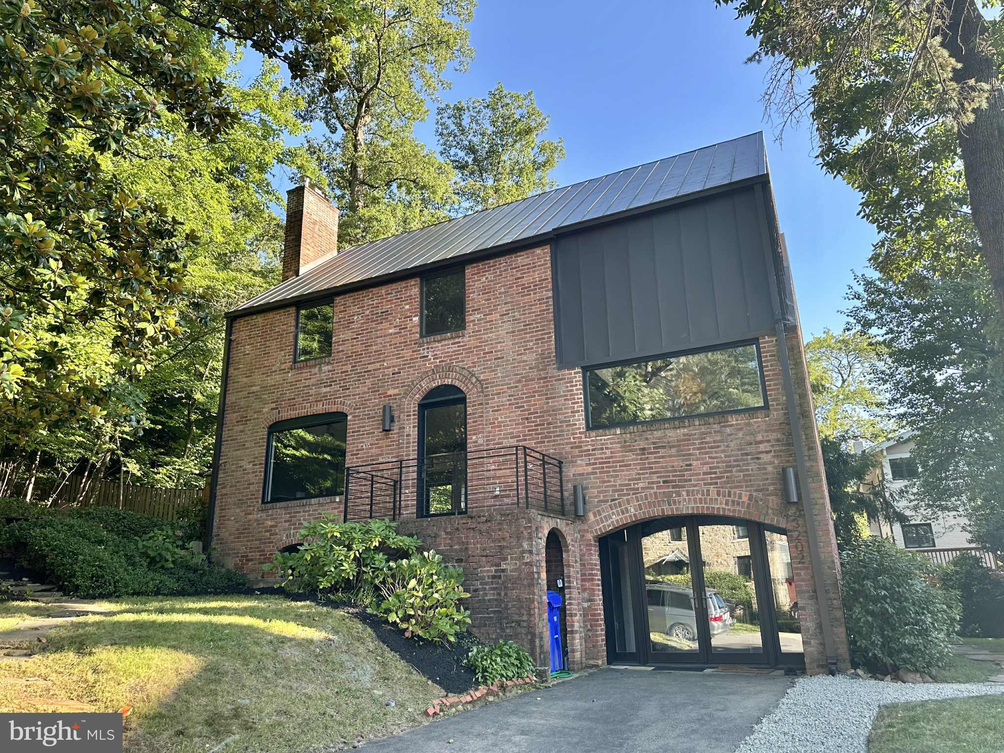 Exceptional Lyon Village luxury rental! This fully reimagined 5BD/3.5BA home sits at the end of a quiet cul-de-sac of only six residences, offering rare privacy with a lush forest backdrop showcased through the dining room’s dramatic wall-to-wall glass. Inside, a central steel staircase, reclaimed walnut floors, and a striking blend of metal and warm wood create a modern yet inviting atmosphere. The open-plan living and kitchen areas are ideal for entertaining, with direct flow to a landscaped backyard and a private driveway—uncommon in this location. Renovation followed Arlington Green Home Choice guidelines, reusing original materials and more than doubling energy efficiency. Walk to Clarendon’s vibrant shops, restaurants, and the Italian Store, or hop on the Custis Trail for a quick bike commute to DC. Minutes to Metro, parks, and top-rated Taylor/Dorothy Hamm/Washington-Liberty schools. Strictly no pets or smoking. Virtual tours available upon request.