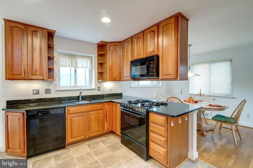 This is not your typical rambler!  Notice the gorgeous open floor plan the minute you walk in the door.  The kitchen has been opened to the living and dining rooms and updated with recessed lights, newer appliances, a large pantry, and granite.  As you head down the hall to the bedrooms notice the large open stairwell to the lower level.   The home has been modernized with updated mechanical systems and lots of storage space. A driveway provides off street parking.  The ART Bus is just outside your door or if you prefer to walk, the  Metro is just 1 mile away.