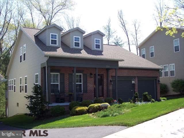 Spectacular back yard stretches well into the woods and borders the Association's green space for seclusion and considerable privacy. This unparalleled home offers elegance and style encompassing nearly 4,000 sq. feet of living space. Exceptional appointments include an 18' foyer, hardwood flooring, double sided fireplace, sunroom and lower level family room with wet bar and more! Stylish cherry cabinets, SS appliances (dishwasher and refrigerator are NEW) and granite counters create your gourmet kitchen joining a fabulous sunroom/breakfast area. 3 of the 4 bedrooms boast walk-in closets. First floor owners' suite is quite a step-saver. Access to Clubhouse with workout facility and outdoor pool for added enjoyment! $8,000 carpet allowance.