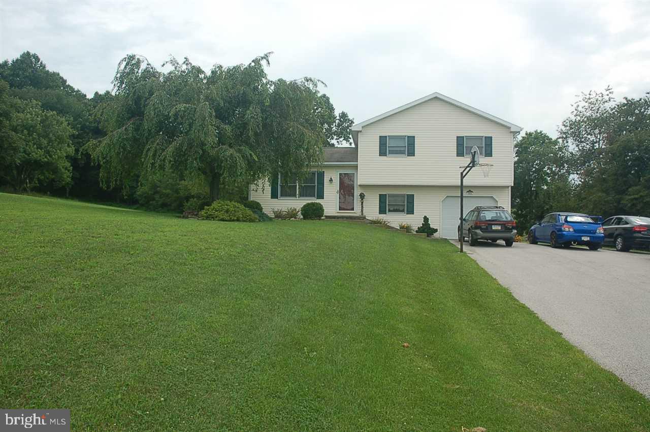 Beautifully maintained 4 Bdrms, 2 full baths home in the country on 1.26 acres with an open floor plan. Large Kitchen with kitchen island. Gorgeous composite deck with above ground pool just waiting for you. 2 wood sheds for storage. You will not be disappointed in this home.