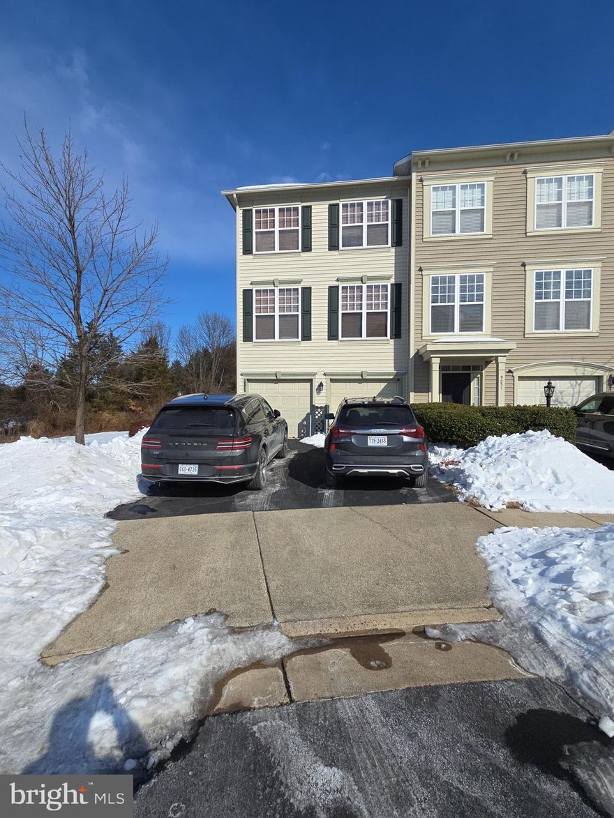 Hurry and see this beautiful End Unit townhome in Victory Lakes with a 2 car garage that has loads of natural light! You'll love the 3 Bedrooms, 2 full baths and 2 Half Baths with beautiful, modern pedestal sinks! The family cook will delight in the spacious kitchen with its 5-burner gas stove, Granite counters with tile backsplashes, upgraded wood cabinets, hardwood floor, granite counter top prep island with extra storage space, pantry & newer stainless steel appliances and a breakfast/dining area with a ceiling fan/light to move those cool summer breezes from the oversized sliding glass door that opens out to the 12 x 18 Trex Deck with PVC railings! This house backs to trees for peace and privacy! Spacious Living room with ceiling fan/light! The Primary Bedroom boasts a high ceiling with a lighted ceiling fan and a walk-in closet. The Primary Bath with oversized tiled walk-in shower, double sinks and side-faucet soaking tub has ceramic tile floor. There are 2 additional large bedrooms on the upper level and a 2nd full bath with a ceramic floor, a tiled tub shower and separate linen closet. The upper level has a large hardwood hallway containing a wonderfully convenient Laundry closet with a drip pan for your washer next to an electric dryer hookup. The side entrance covered front porch opens into a two-story Foyer with ceramic tile stepping down into a cozy  Family Room with a romantic gas fireplace topped with a wood mantle and white marble trimming, as well as a recessed entertainment unit shelf area, plus an additional half bath with pedestal sink and ceramic floor. The lower level sliding glass door opens onto a  patio with large pavers and is fenced for privacy with a gated back yard. A roomy 2 car garage with separate doors and a door opener open out to a double wide asphalt driveway for parking 2 more cars. The  attractive yard is creatively landscaped with flowering trees and shrubs. This terrific home has many upgrades and enticing features included such as a new 75gal Water Heater with expansion tank in 2025, new roof in 2018 with architectural shingles, new HVAC in 2017 with steam Aprilaire humidifier unit, poly-sealed paint flake garage floor, curtains with Plantation Blinds, Recessed lights, Radon mitigation unit, 9 foot ceilings and beautifully wood-grained hand railings inside. A 24 hour notice is required for showings with limited hours on weekdays due to spouse working nights. Weekend times have more accessible hours.