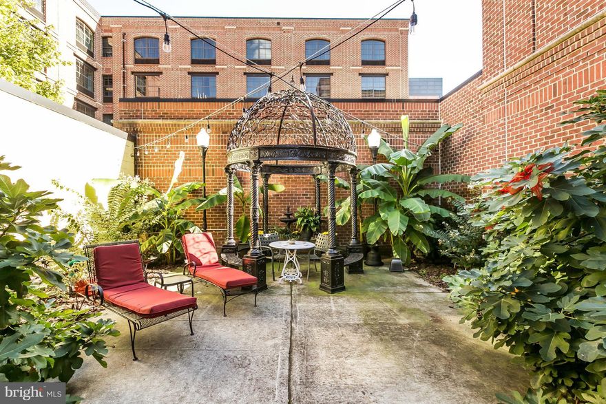 This beautiful, double-wide rowhouse - built in 1792 has been remodeled into a spacious urban retreat 3 blocks from InnerHarbor. Complete w/a large courtyard OASIS- This 4 bedroom home has approx. 2600sqft of generous finished space w/ expansive, restaurant-style kitchen,magnificent 7-foot wide fireplace, courtyard, w/ high brick walls, GORGEOUS garden&wood floors+more. Z B-33