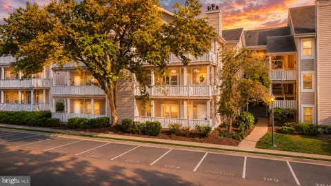Photo of 14317 Climbing Rose Way #104, CENTREVILLE, VA 20121 (MLS # VAFX2323388)