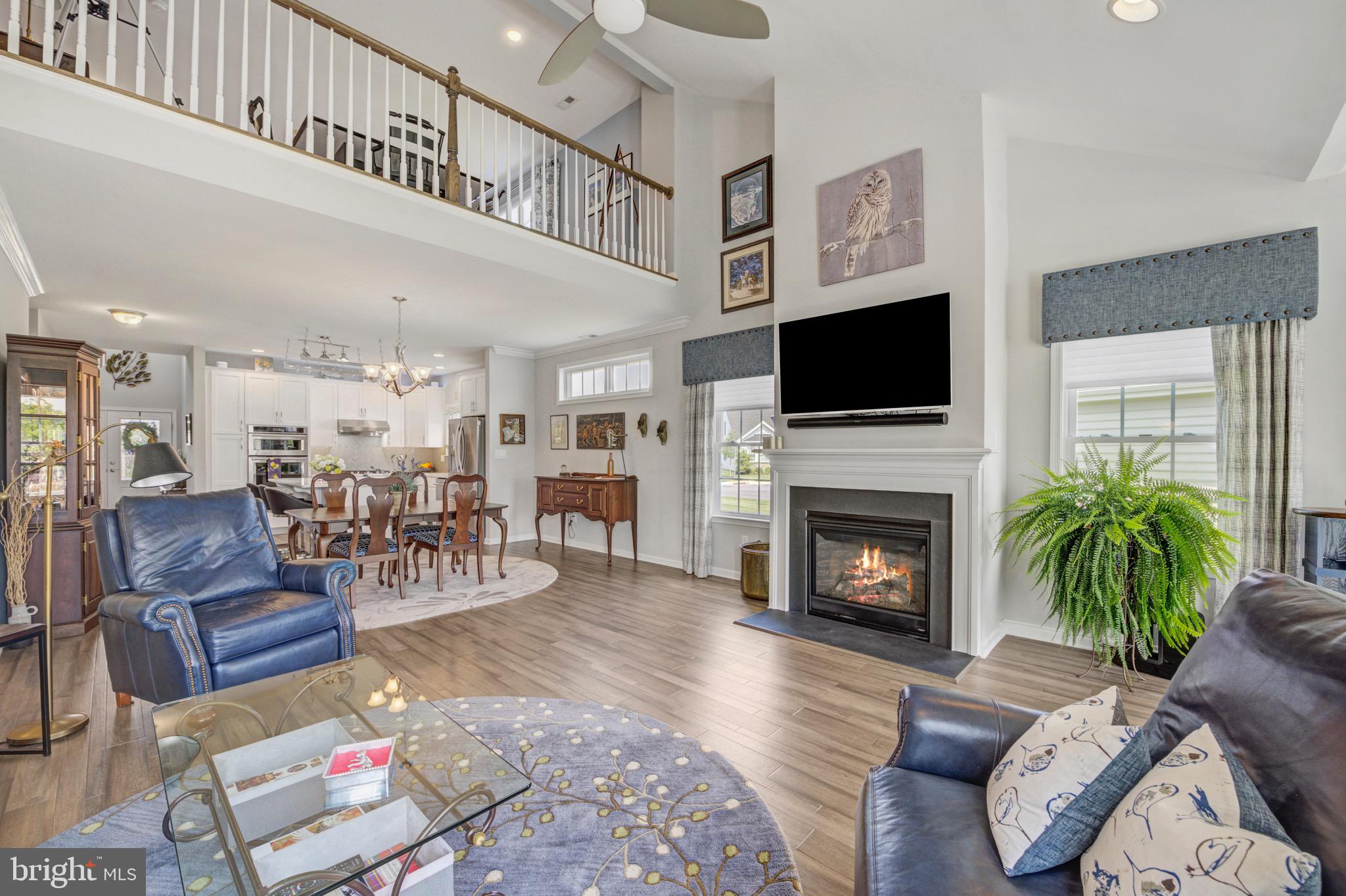 DEADLINE SET- ALL AGREEMENTS MUST BE IN BY FRIDAY, 8/15, AT 10:00am. Welcome to 119 American Way, an extraordinary showcase of custom luxury, set in the heart of the award winning Traditions of America at West Brandywine- Chester County's most coveted 55+ resort style community. Built in 2020, this "nearly new" 2535 sq. ft. home has been elegantly customized and lavishly upgraded with over $158,000. in premium enhancements- every inch thoughtfully designed & professionally decorated for the most discerning buyer. Step inside & be wowed by the sophisticated open floor plan . The gourmet kitchen is a dream for chefs and entertainers alike featuring upgraded Yorktown cabinetry, Cambria countertops, a 30"built-in wall oven, stainless steel appliances, touchless faucet, tile backsplash, under cabinet lighting and a large center island for dining. The formal dining room area makes a statement all its own. Expansive in size & ideal in layout, it easily accomodates a large dining room table, china cabinet & buffet- perfect for family gatherings. The great room is the heart of the home with soaring ceilings, rich hardwood flooring and a warm gas fireplace. The adjacent sunroom, awash in natural light, is a serene space offering views of the beautiful, lush gardens. Sliding glass doors lead to a one-of-a- kind expanded blue stone patio. This outdoor sanctuary is intergrated with hardscaping, ambient lighting, custom landscaping & a built-in gas fire feature with smart home technology. Ideal for those 4th of July barbecues! The spacious first floor owner's suite features a tray ceiling with ceiling fan, plush carpeting & huge closets. The ensuite bathroom boasts a frameless glass shower, upgraded Vessel sinks and cabintry, a custom makeup station and even a bidet! An additional 1st floor bedroom & full bath offers space for guests or can be utulized as a home office. A conveniently located laundry facility and a two car attached garage complete the first level.
A rare expanded second floor loft elevates the home's versatility & livability. This upper level retreat offers a full bedroom and bathroom, making it perfect for overnight guests or live-in caregivers. But it doesn't stop there- the loft also features a spacious living area that can flex effortlessly to suit your lifestyle. Whether you envision a media lounge, art studio or home office, this bright bonus space is ready to be transformed. The great room, primary bedroom and second floor loft all have 110 AC, CAT TV, HDMI and even Ethernet. Tucked discreetly away is a massive walk-in storage area-generously sized to hold a lifetime of seasonal decor, travel gear, family heirlooms and everything you are not quite ready to part with. In a world that downsizing doesn't always mean minimizing, this unique feature offers the breathing room you didn't think was possible.
Other upgrades include: elegant front door, a whole house stand-by generator, Aprilaire electronic air purifier, Aprilaire humidier, custom window treatments throughout, Transom windows, upgraded upstairs railing, patio door internal blinds, all lighting, Monitored Guardian whole house security system.
And just beyond your front door? The 6600 sq. ft. private clubhouse with a full time Life Style Director to fill your social calendar with all kinds of events and activities! Residents enjoy access to a sports bar, fitness center, yoga studio, billards room, game room, even a dog grooming center. Outdoors unwind in the heated pool and spa, hit the pickleball or tennis courts, grill at the outdoor patio or gather around the firepit with neighbors turned friends. Prefer indoor play? There's a golf simulator, pool table and more- all surrounded by scenic walking trails designed for the active adullt lifestyle.
Beautifully built. Brilliantly upgraded. Perfectly turnkey. This is more than a home- it's the lifestyle you have waited for and deserve!