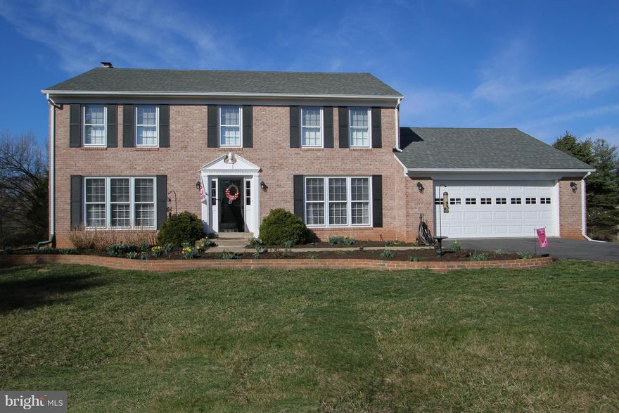 MOVE-IN READY BRICK FRONT COLONIAL*1.53 ACRES W/PANORAMIC VIEWS*2 CAR GAR*3500+ FIN SQ FT 3 LEVELS*5 BR/3.5 BA*HARDWOOD MAIN & UPPER LEVELS*10 CEILING FANS*UPDATED KIT W/GRANITE, ISLAND, & CERAMIC FLR*FAM RM OFF KIT W/BUILT-IN CABINETS & WOOD STOVE*UPDATED BATHS W/GRANITE *FIN WO DAYLIGHT BASEMENT W/NEW CARPET, REC RM, BR, DEN, BA, & WORKSHOP*LARGE DECK*BRICK PAVER PATIO*NEW ROOF*STORAGE*NO HOA