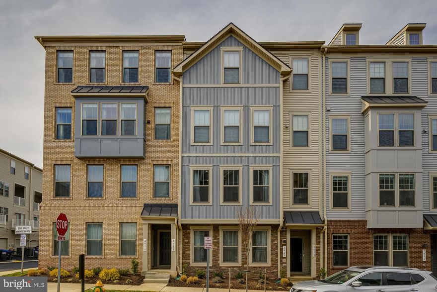 Built in 2023, this 2 bedroom, 2.5 bathroom condo offers approximately 1,606 sq ft in the Village at Manassas Park community. This unit includes a bump out extension providing additional living space compared to similar units. Located near a corner lot, the home receives excellent natural light throughout the day. Features include open concept living, modern finishes, stainless steel appliances, attached garage, and upper level laundry. Furniture included with sale includes couch, bed frame, and 2 flat screen TVs. Convenient access to VRE, shopping, dining, and commuter routes. Move in ready and priced for quick sale.